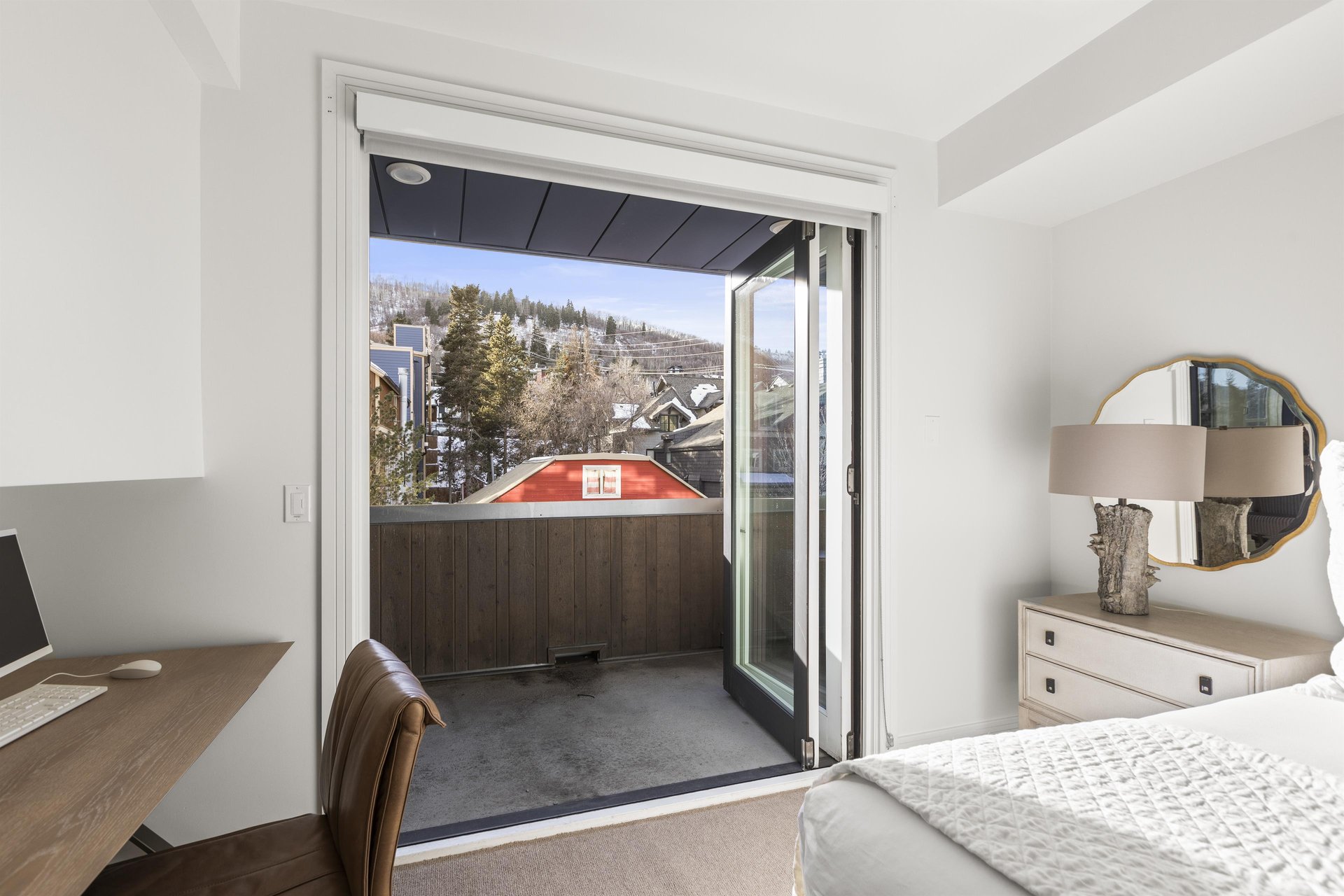 The main suite has accordion doors that lead to a private patio.