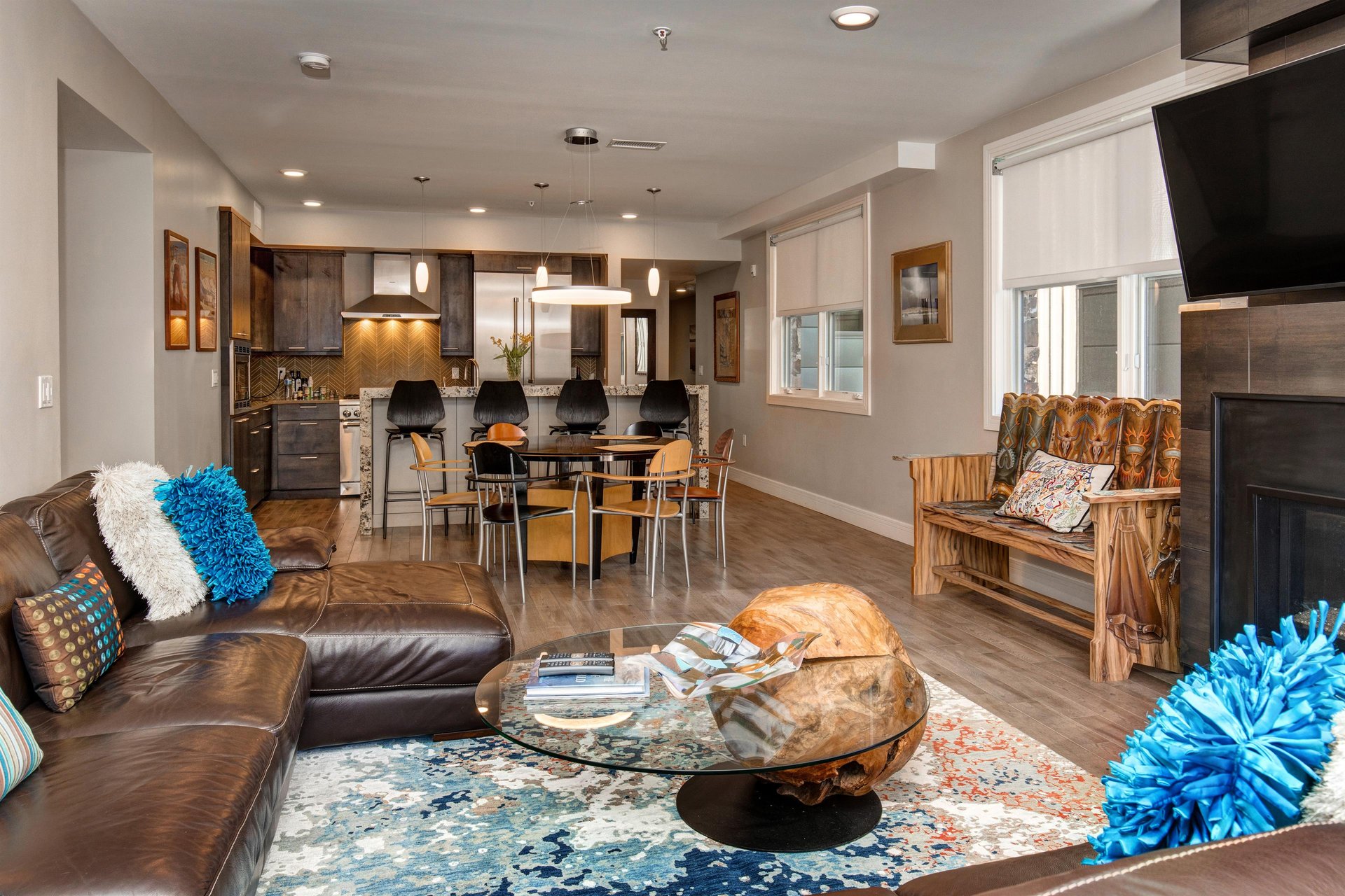 Sophisticated open concept living, dining, and kitchen area.