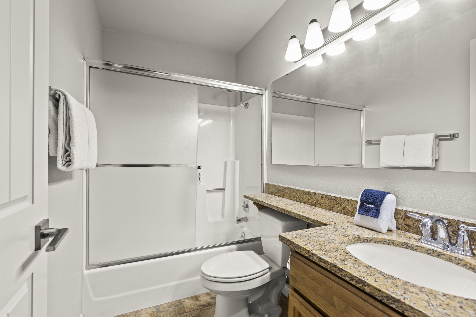 The bathroom with a bathtub and shower combination.