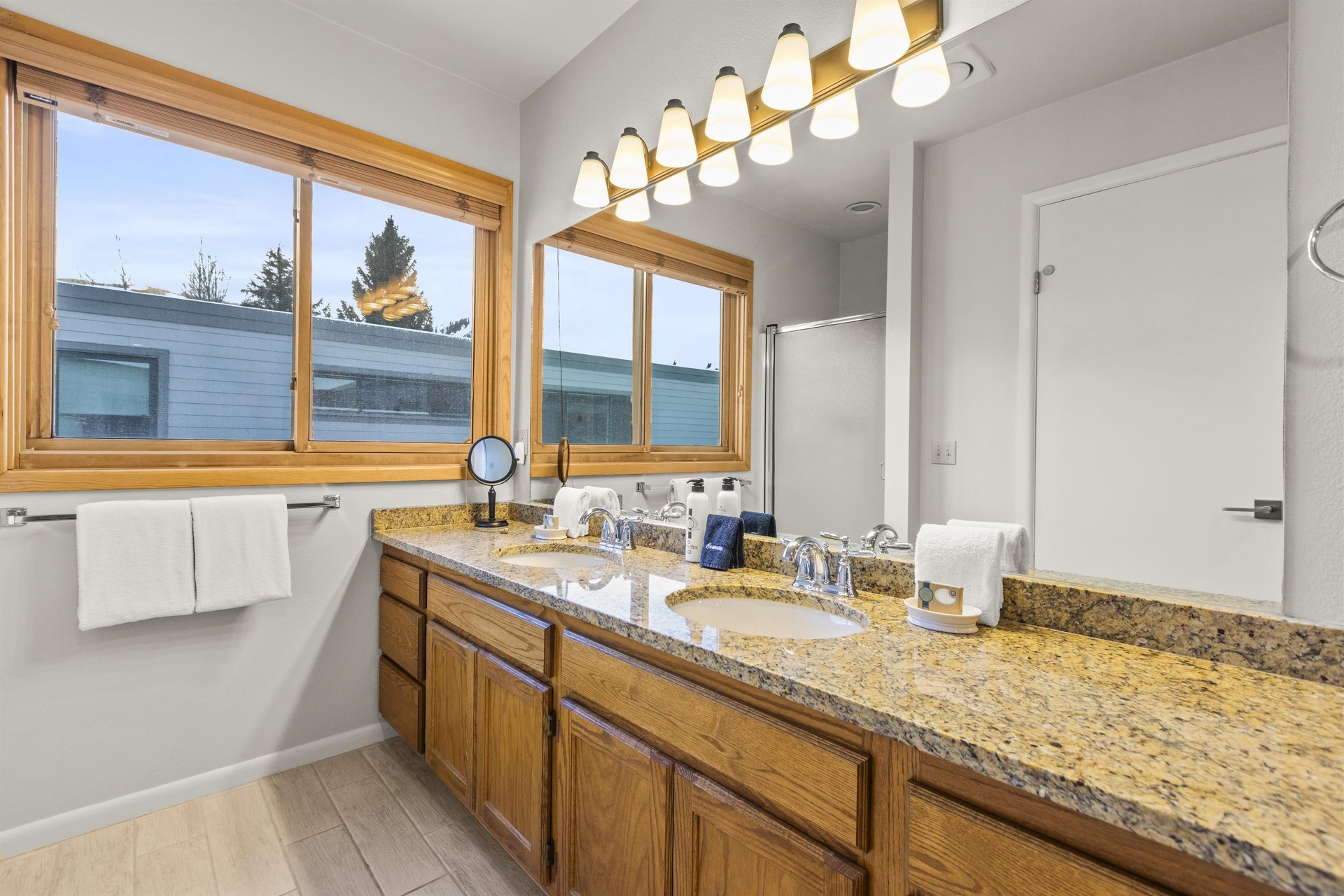 The bathroom with double sink vanity.