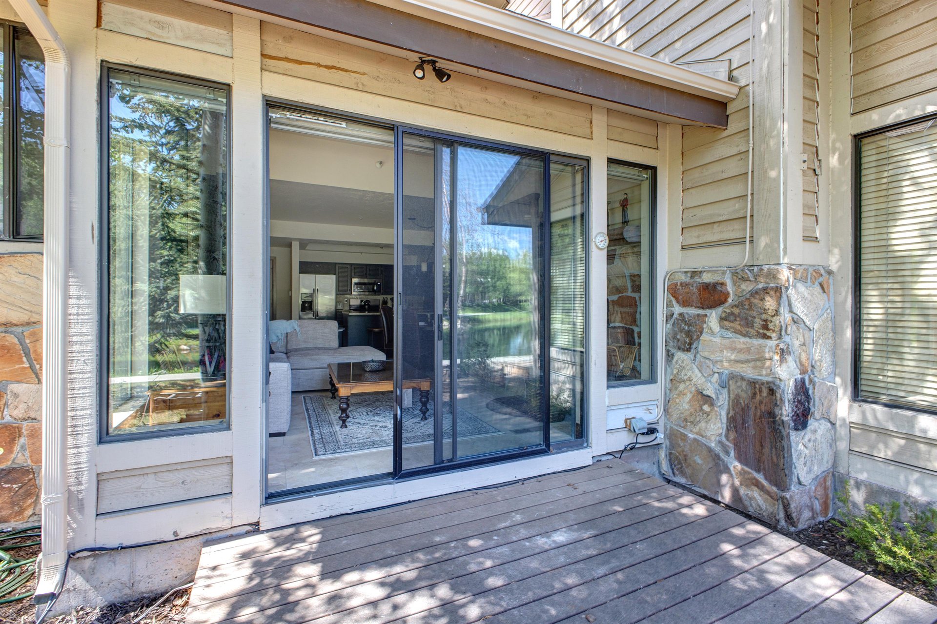 Queen Esther has sliding glass doors that lead to a small deck outside.