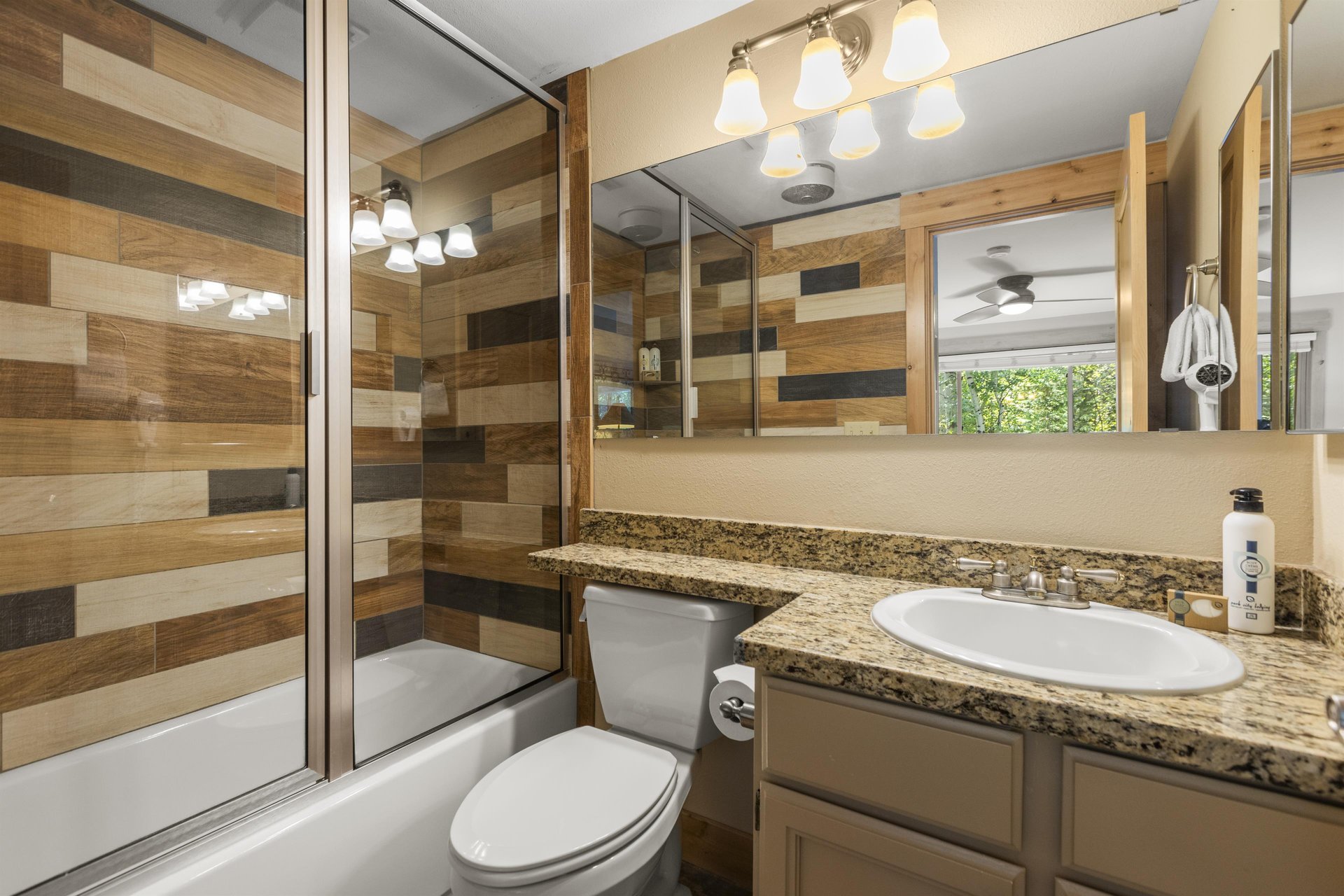 The en suite bathroom has a bathtub and shower combination.