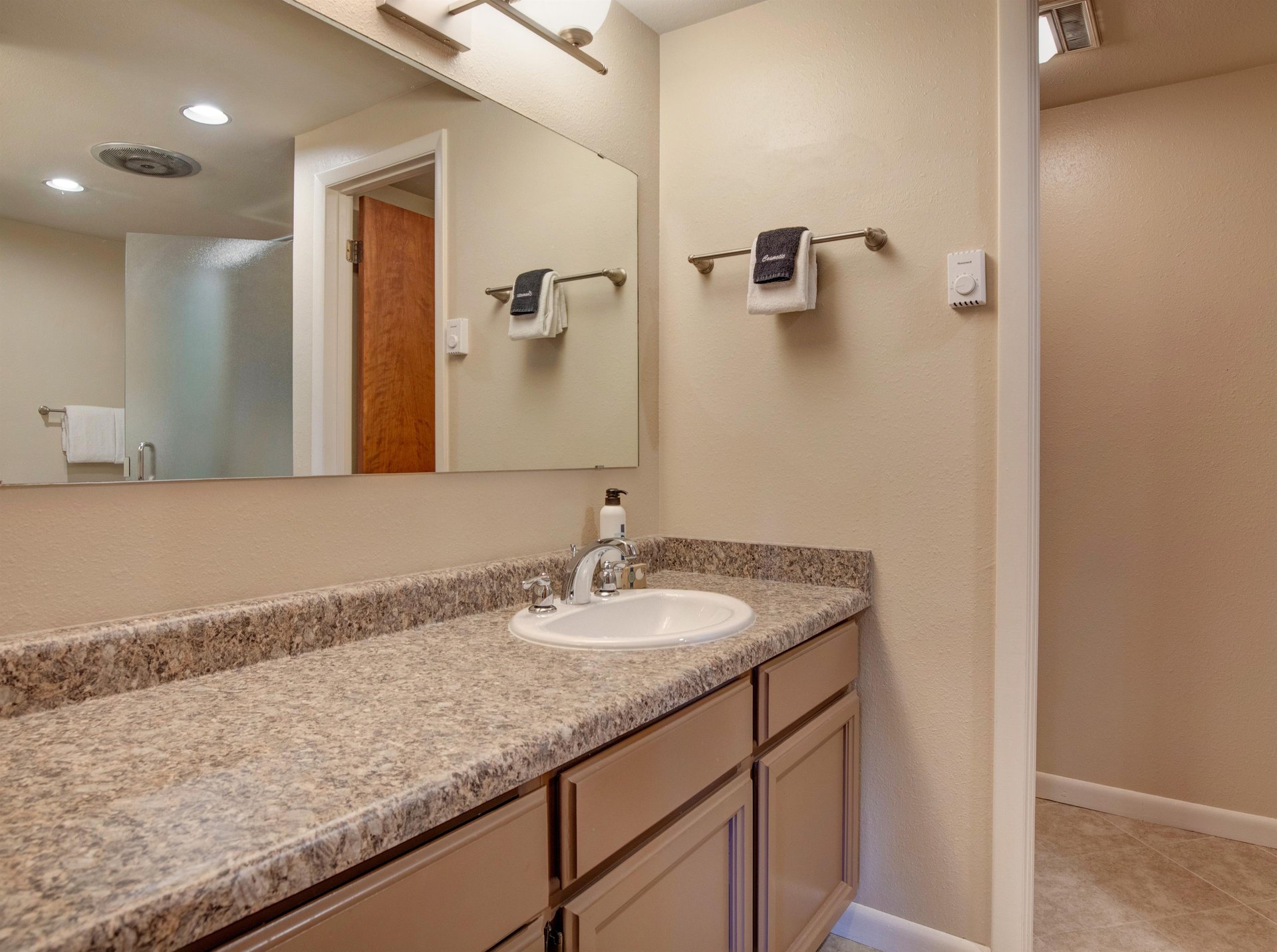 The en suite bathroom with another sink area.