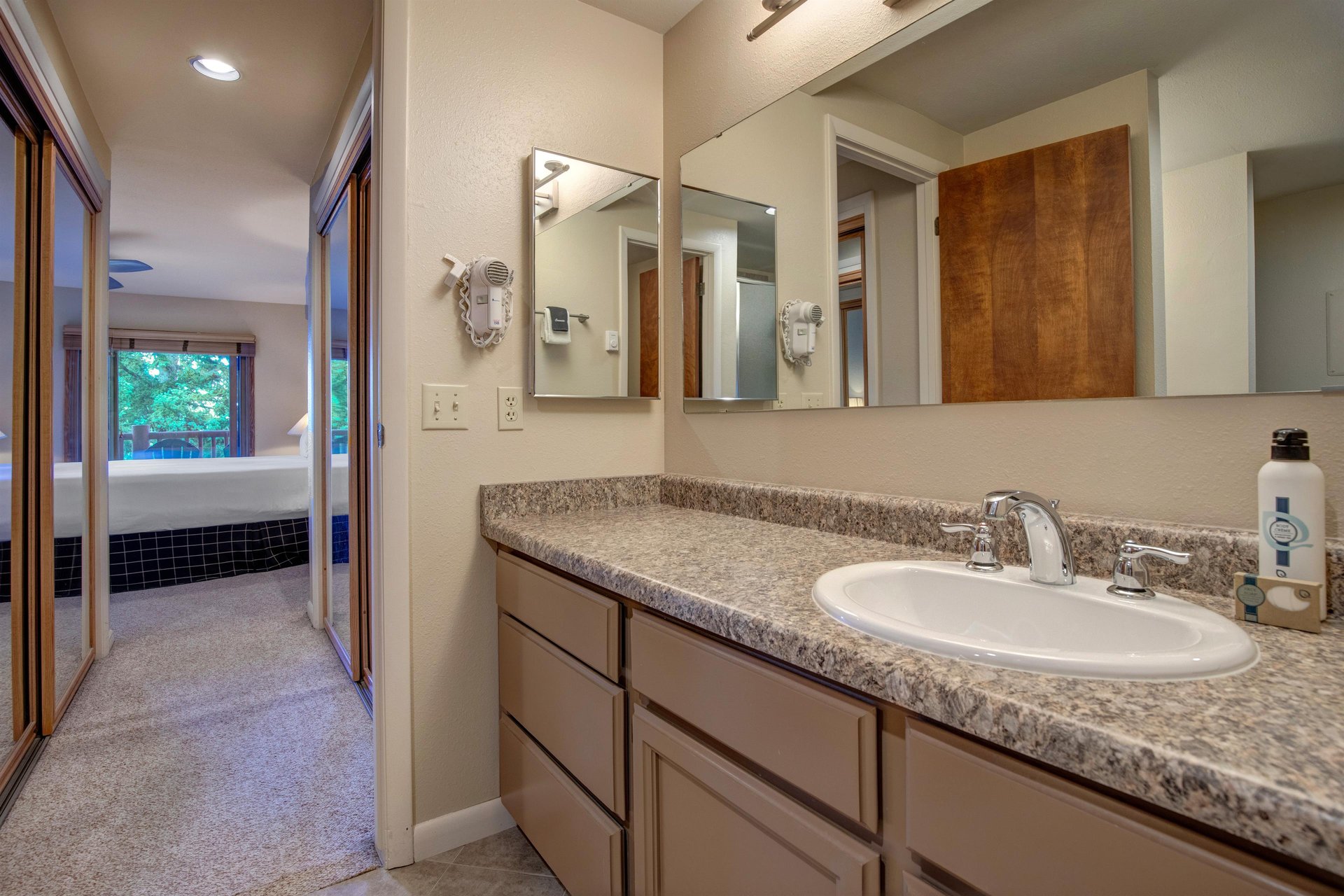 The en suite bathroom with another sink area.