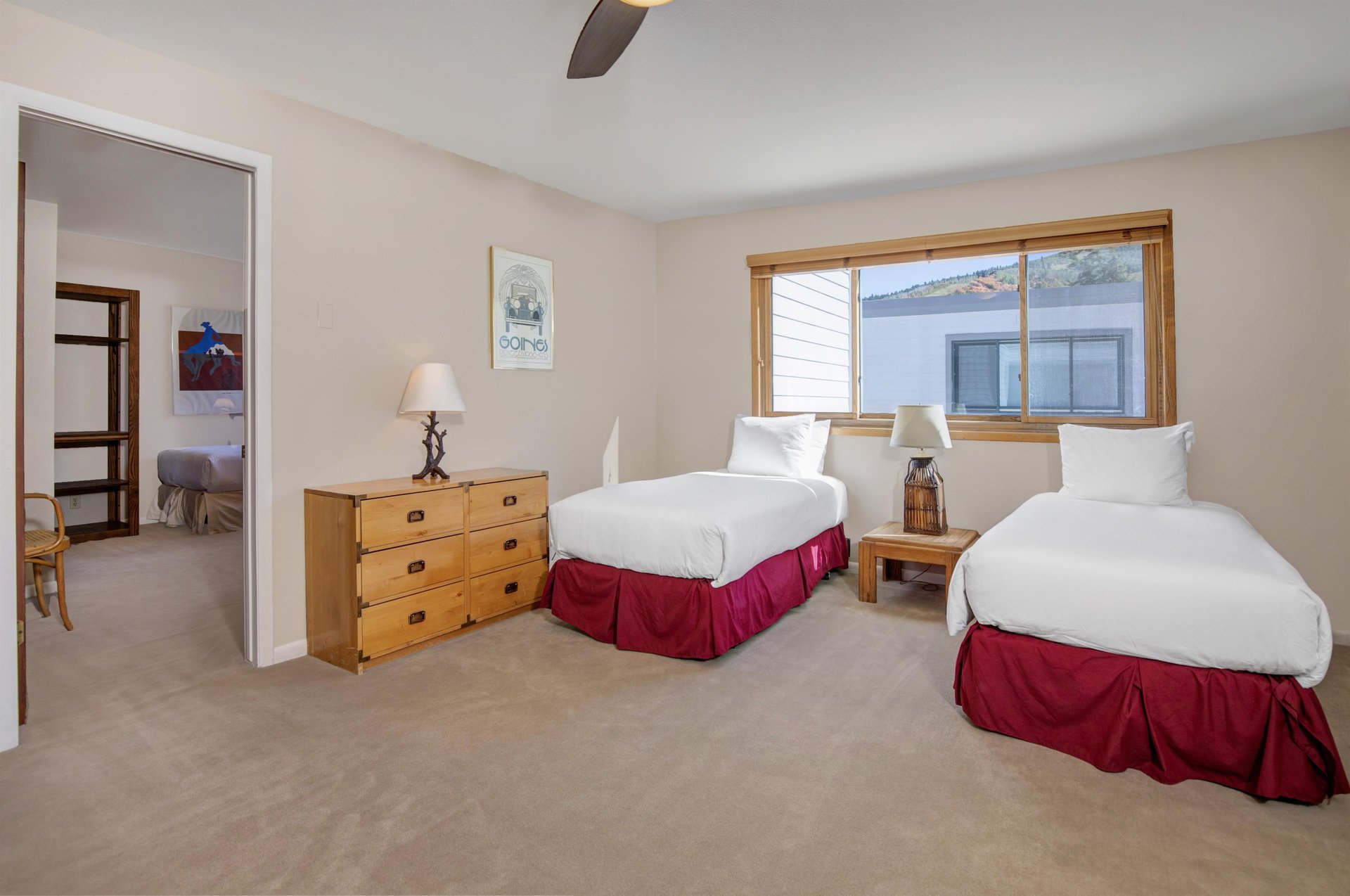 The loft has two twin beds and wood furniture.