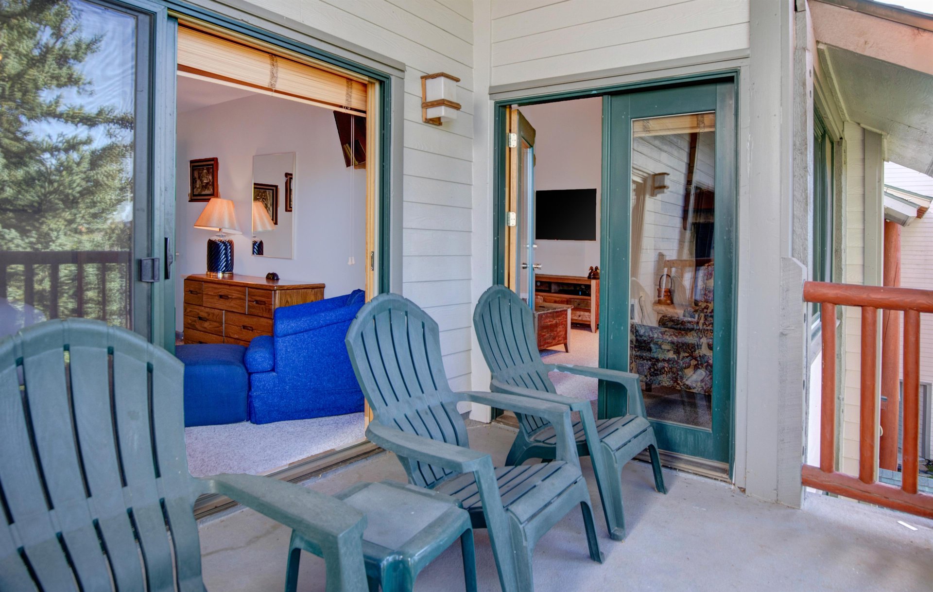 The private deck has four chairs and a small table.