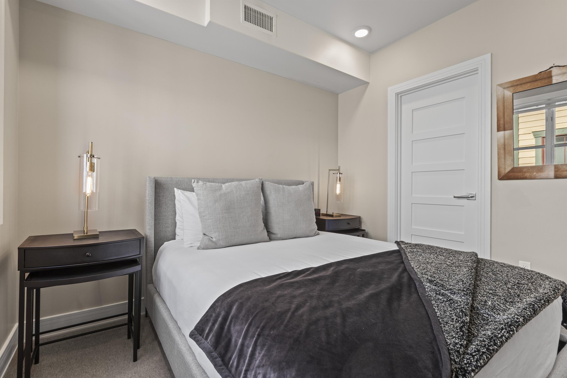 The second bedroom with a queen size bed.