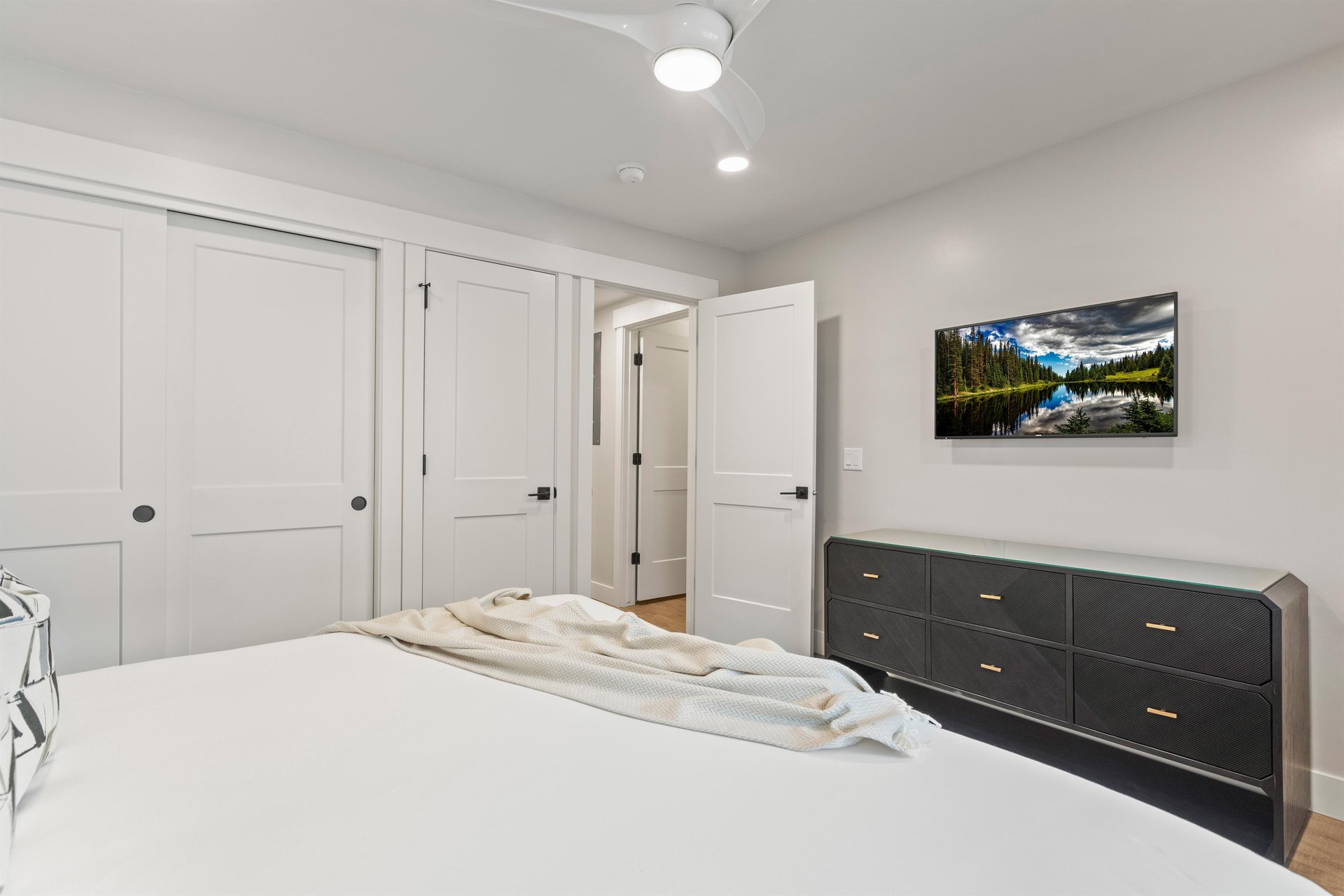 The second bedroom has a king size bed and flat screen TV.