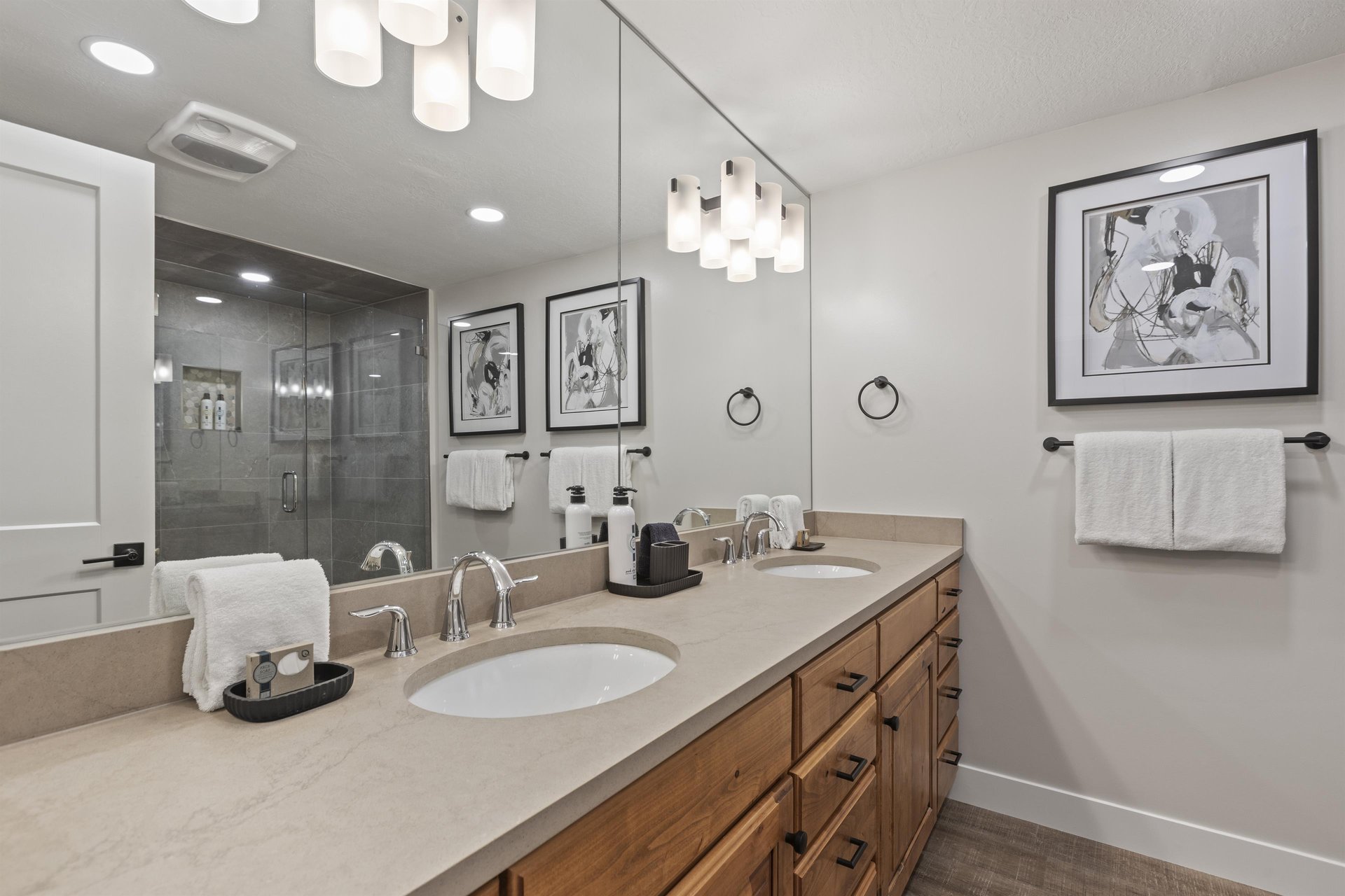 The shared bathroom offers a double sink vanity and walkin shower.