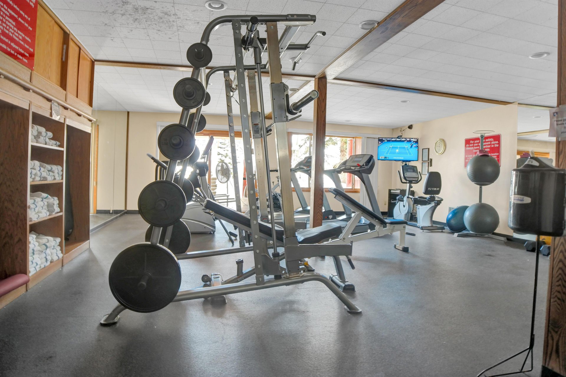 Fitness Room includes various machines and free weights
