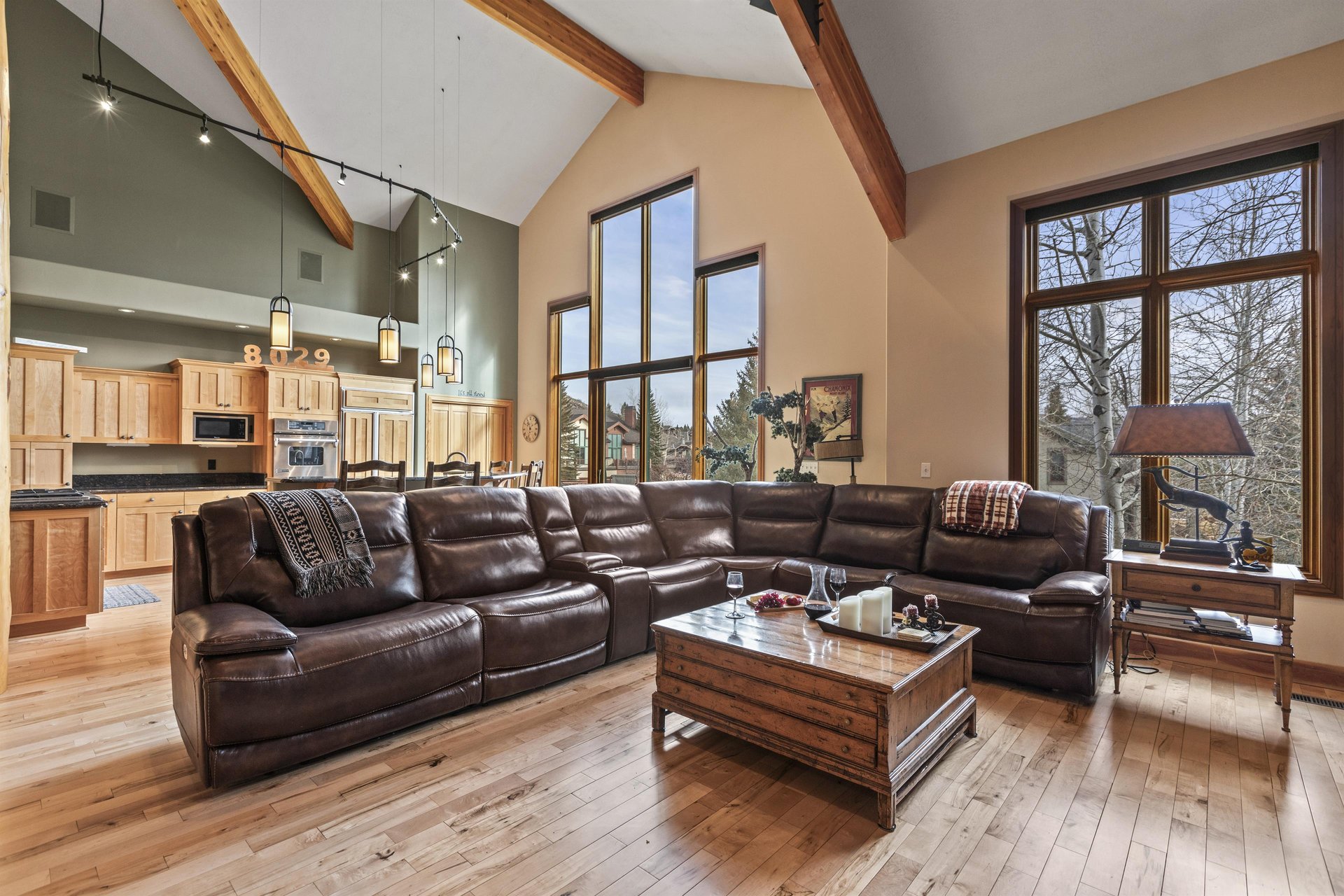 The living room has a spacious sectional sofa with builtin recliner chairs.