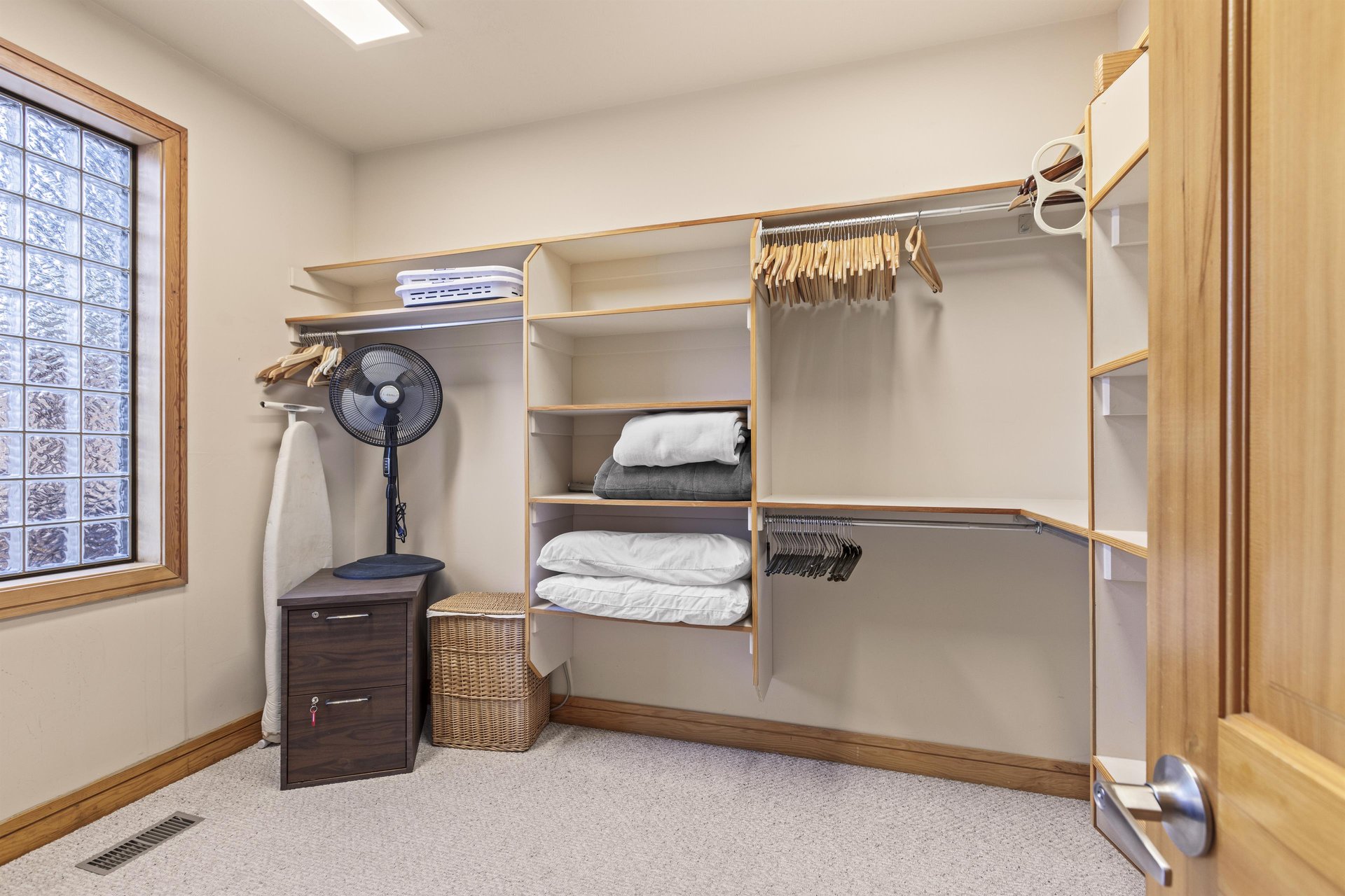 The walkin closet with plenty of storage space.