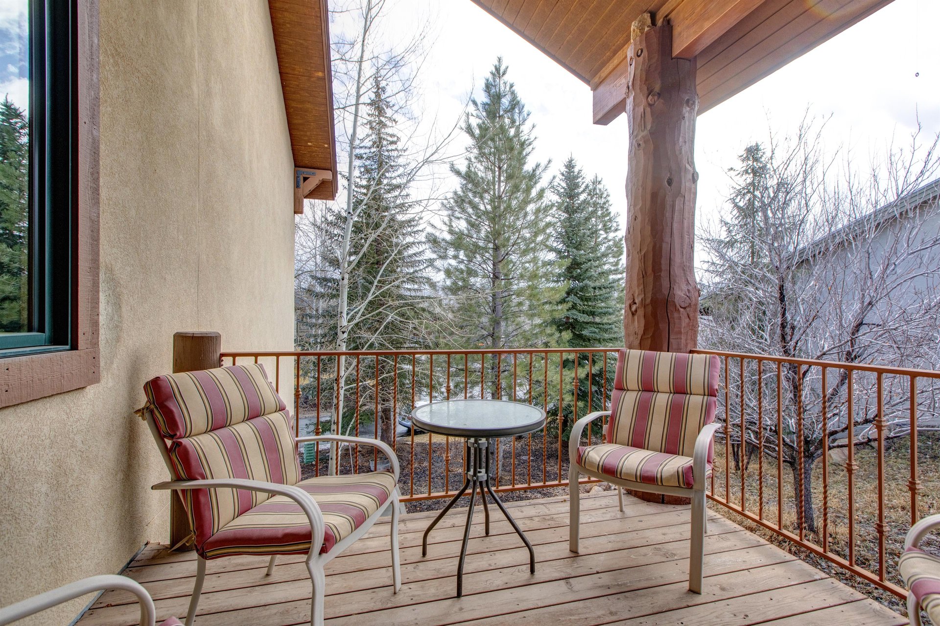 A private patio with seating for two guests.