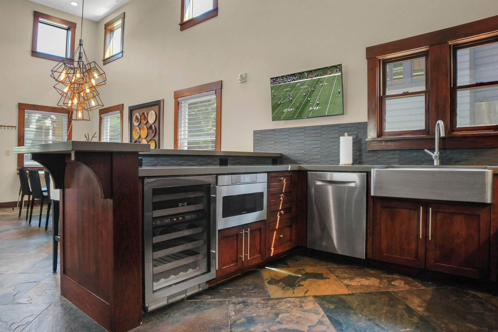 The vacation rental kitchen with wine fridge.
