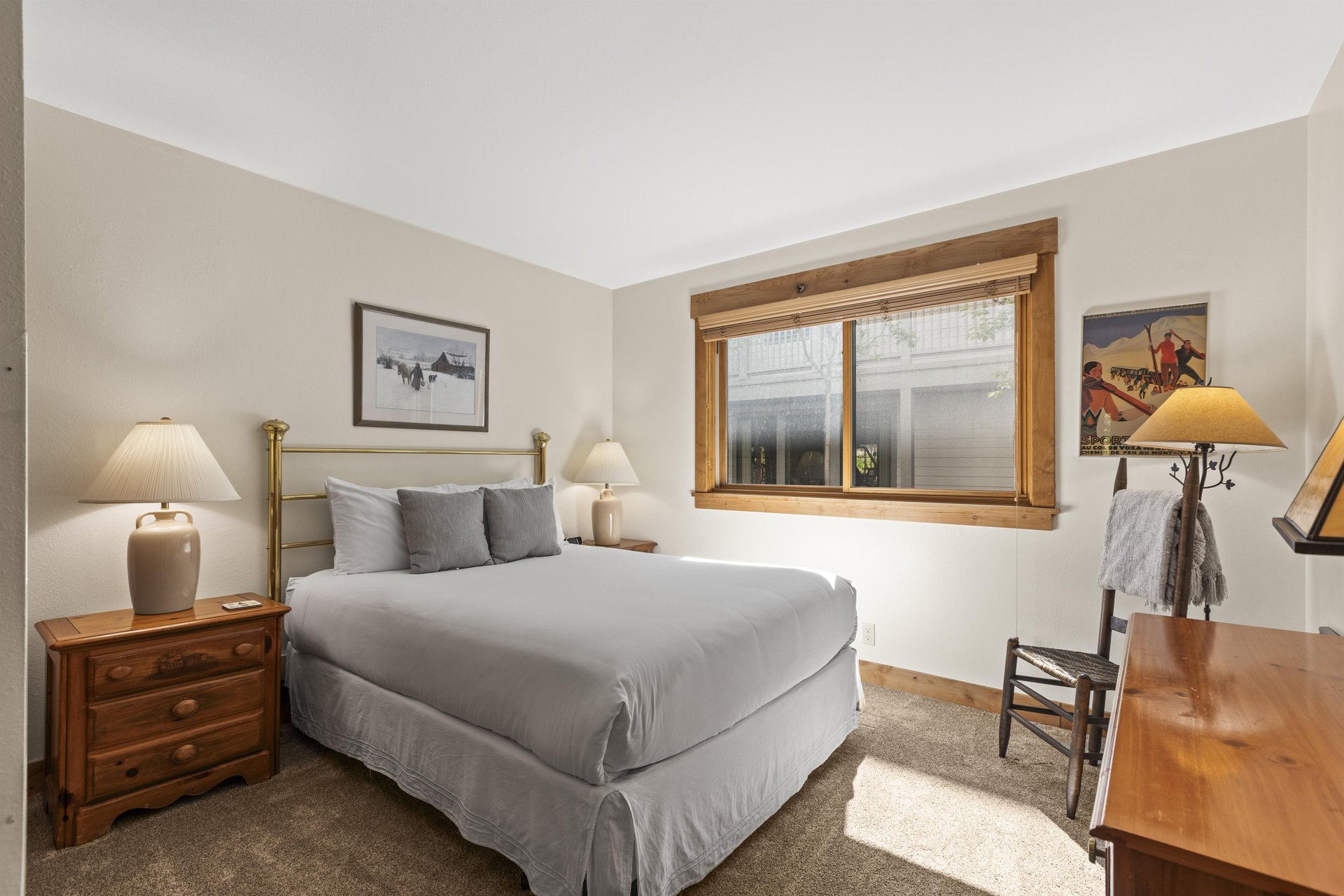 The bedroom offers a queen size bed.