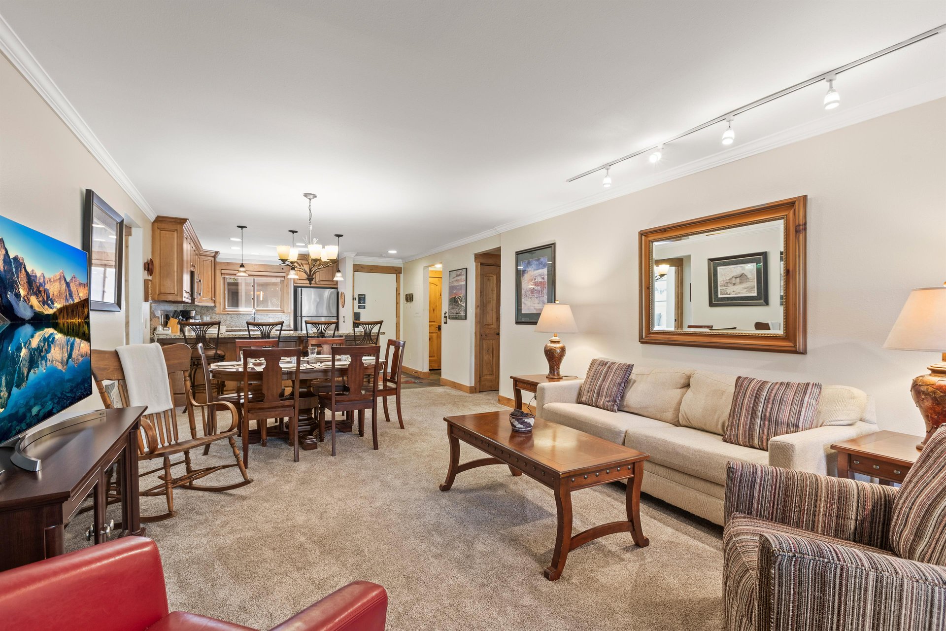 The living area with a comfortable couch and club chairs.