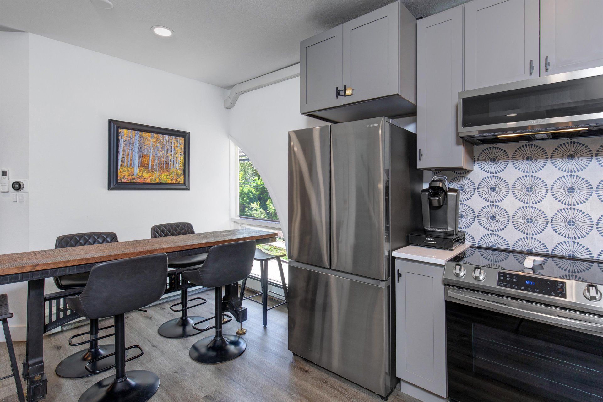 The open concept floor plan  kitchen, dining area, and living area.