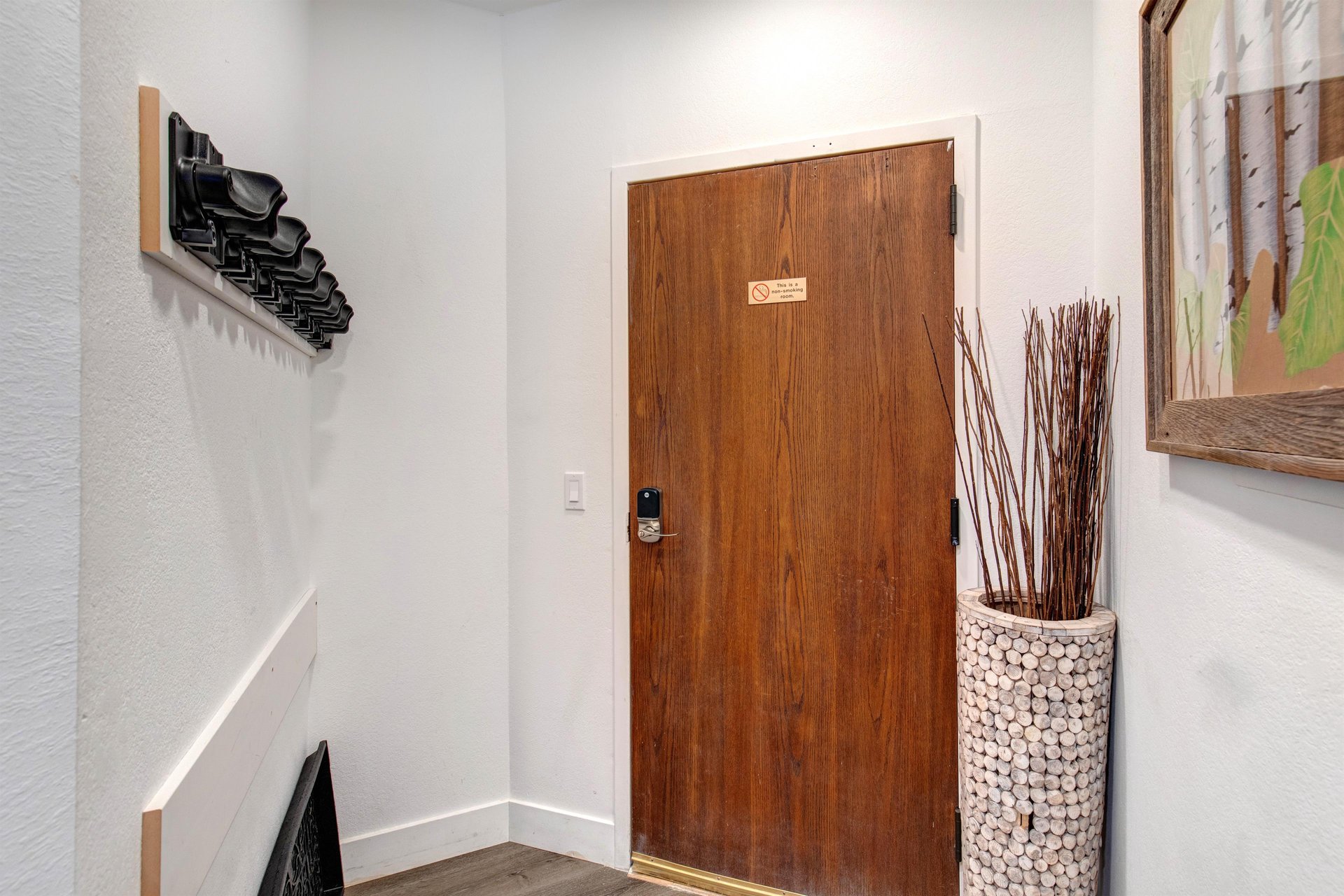 The main entry door with an area to hand coats and put shoes.