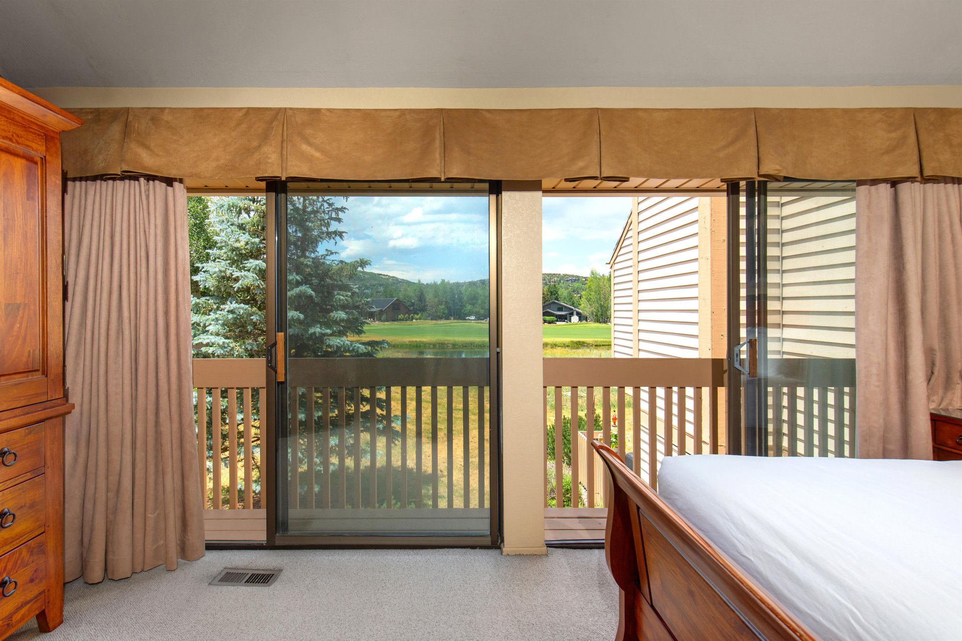 The main suite has beautiful views of the golf course and pond.