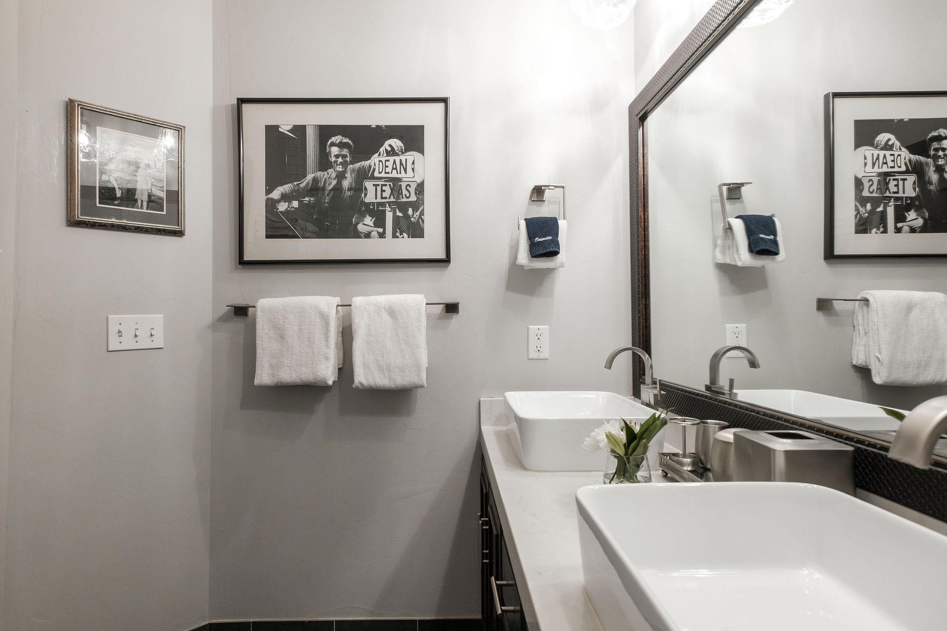 The shared bathroom with double sink vanities.