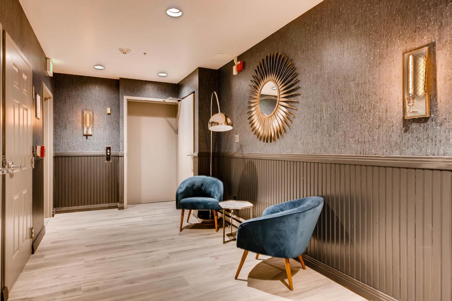 The entryway to the condo with seating for two.