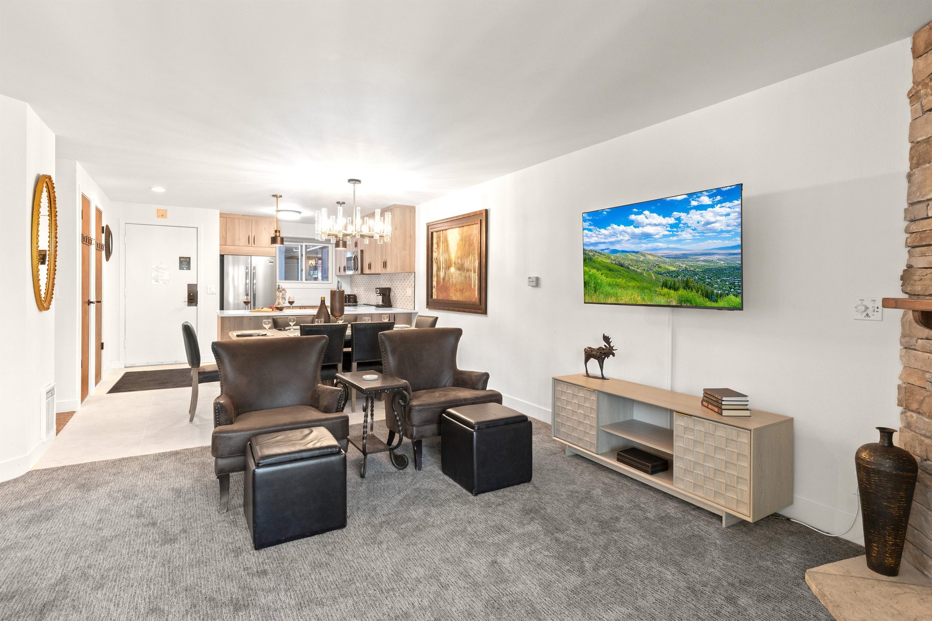 The open concept kitchen, dining room, and living room.