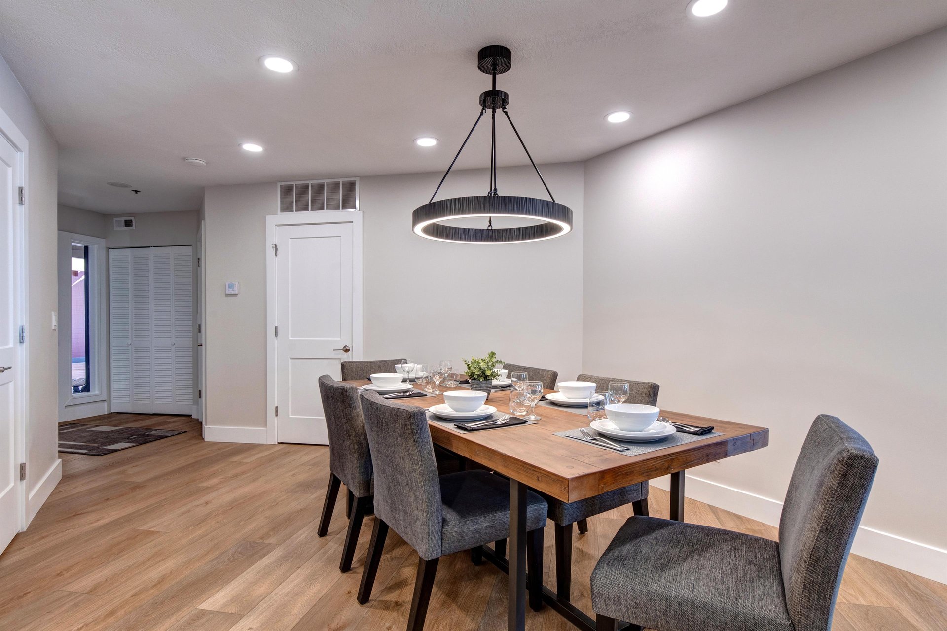 A stylish dining room table offers seating for 6 guests.