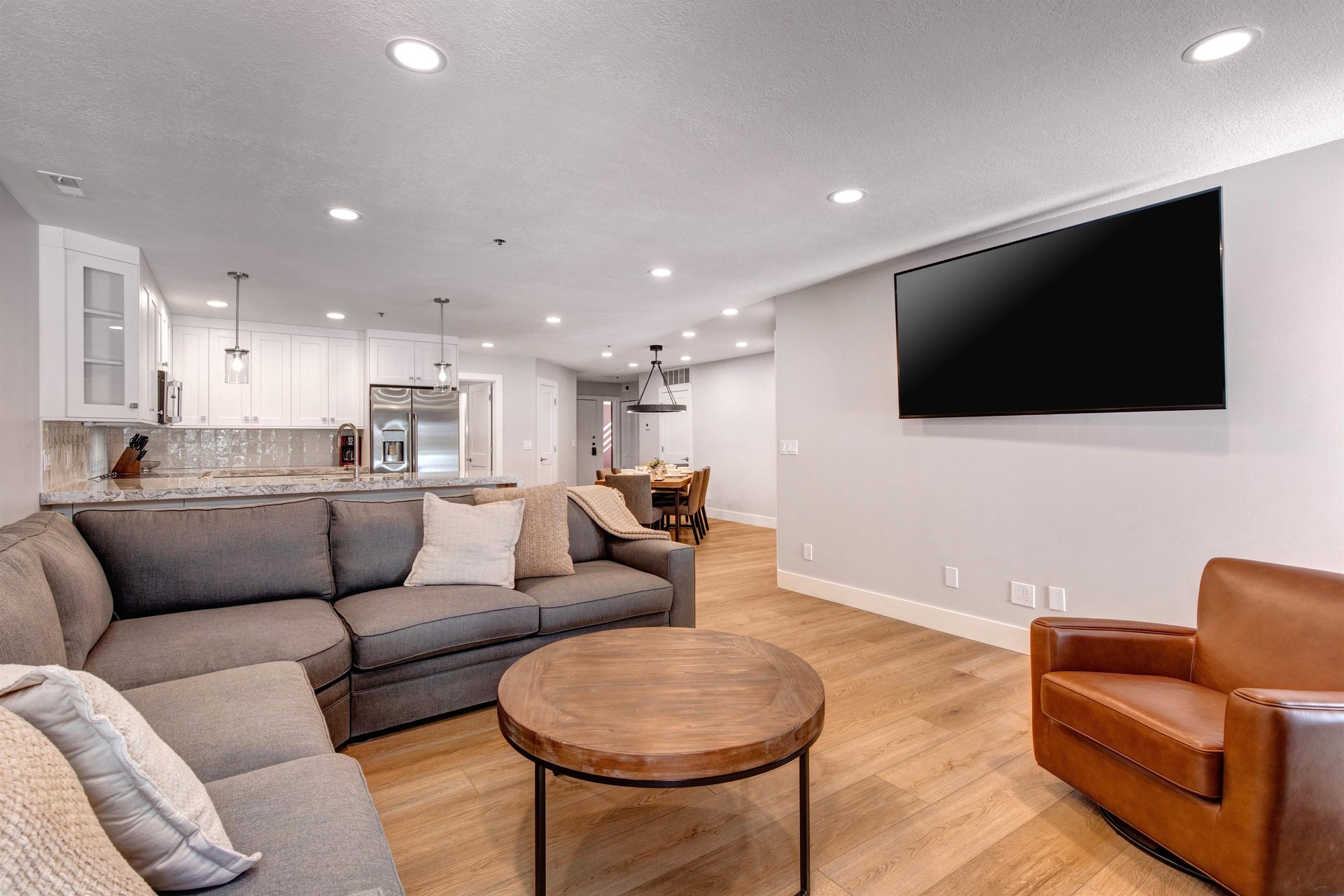 The living area offers comfortable furnishings and flat screen TV.