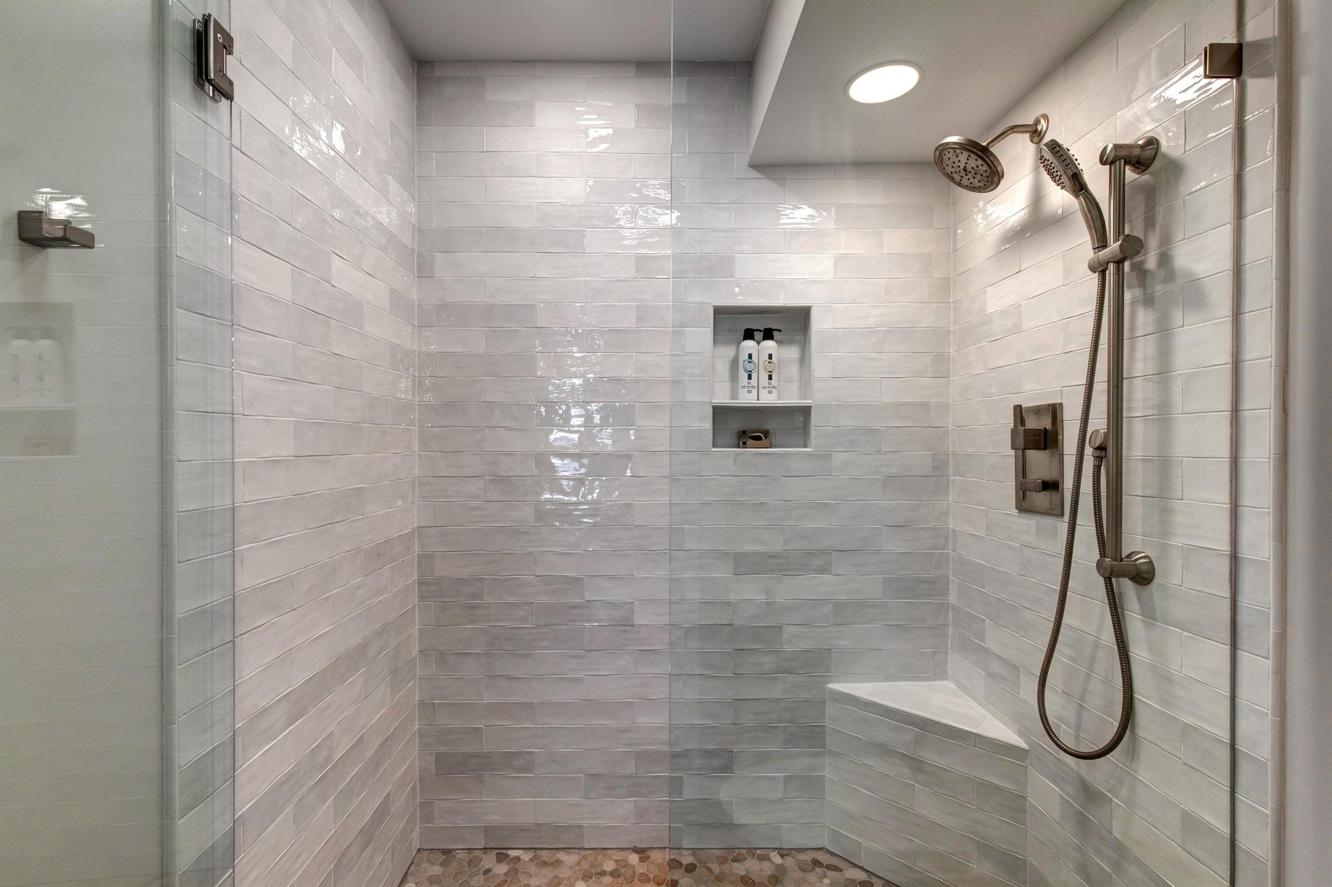 The en suite bathroom has a walkin shower with European glass door.