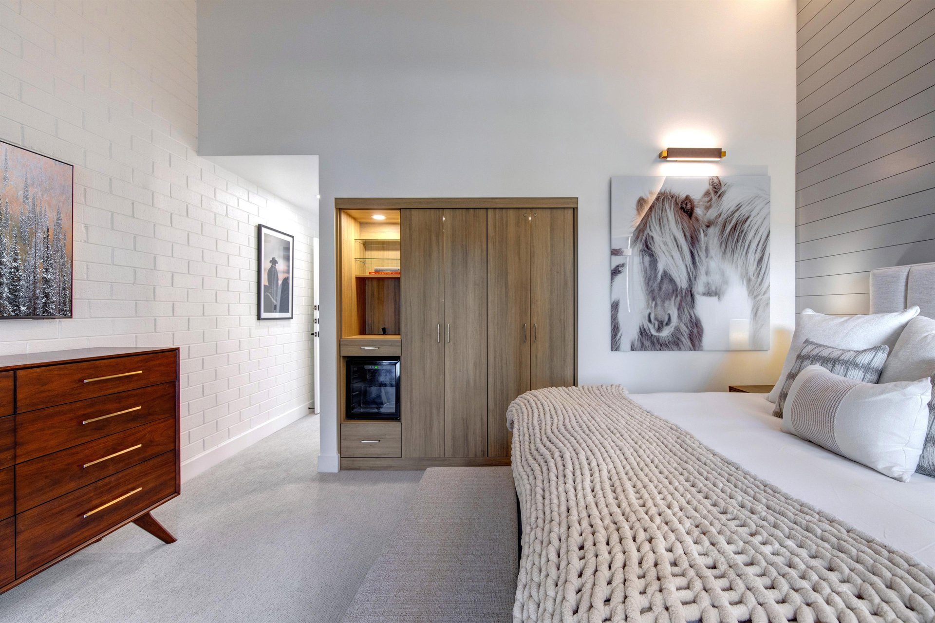 The second main suite with a well organized built in closet system.