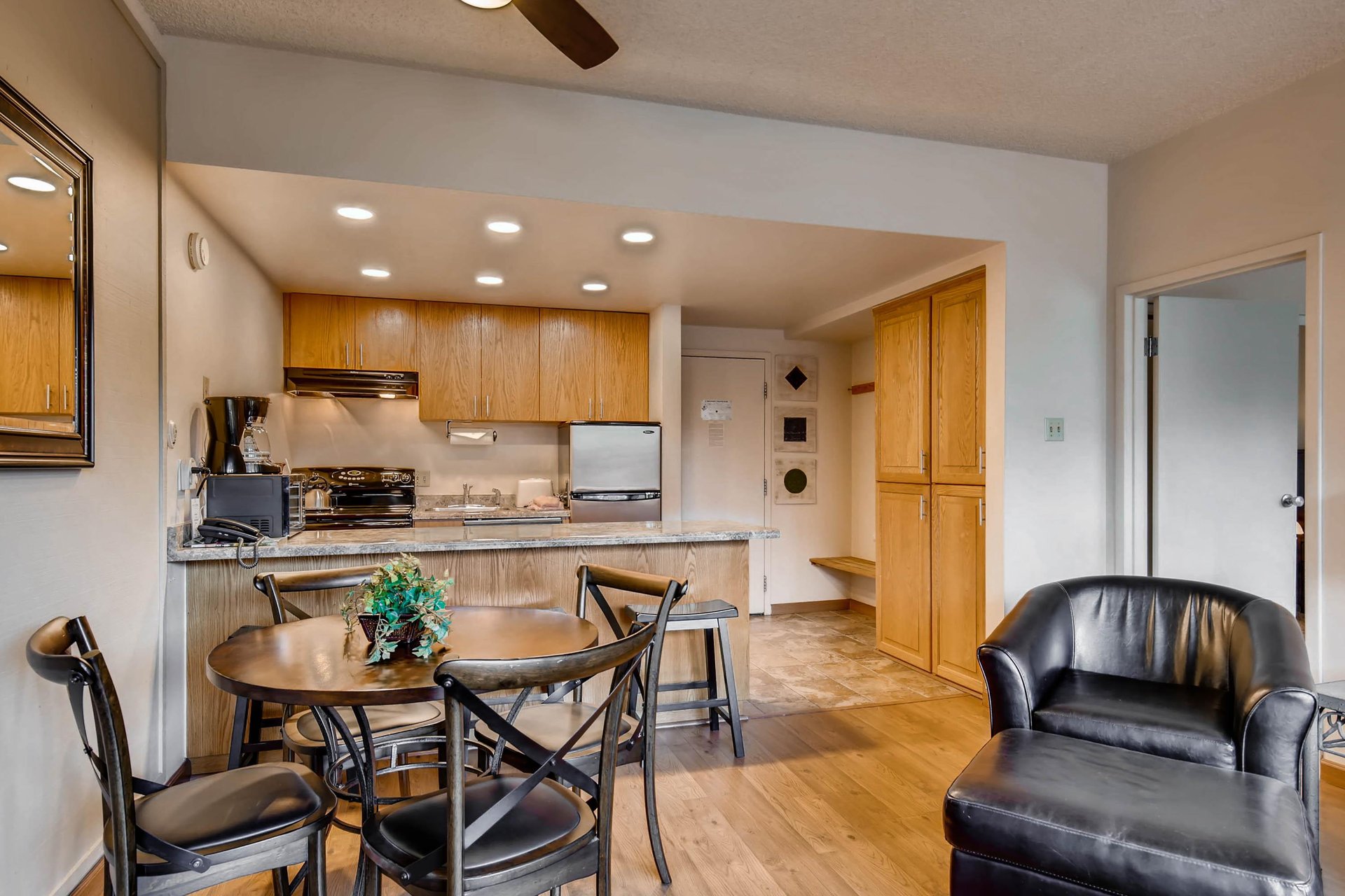 Comfortable open concept kitchen, dining, and living room.