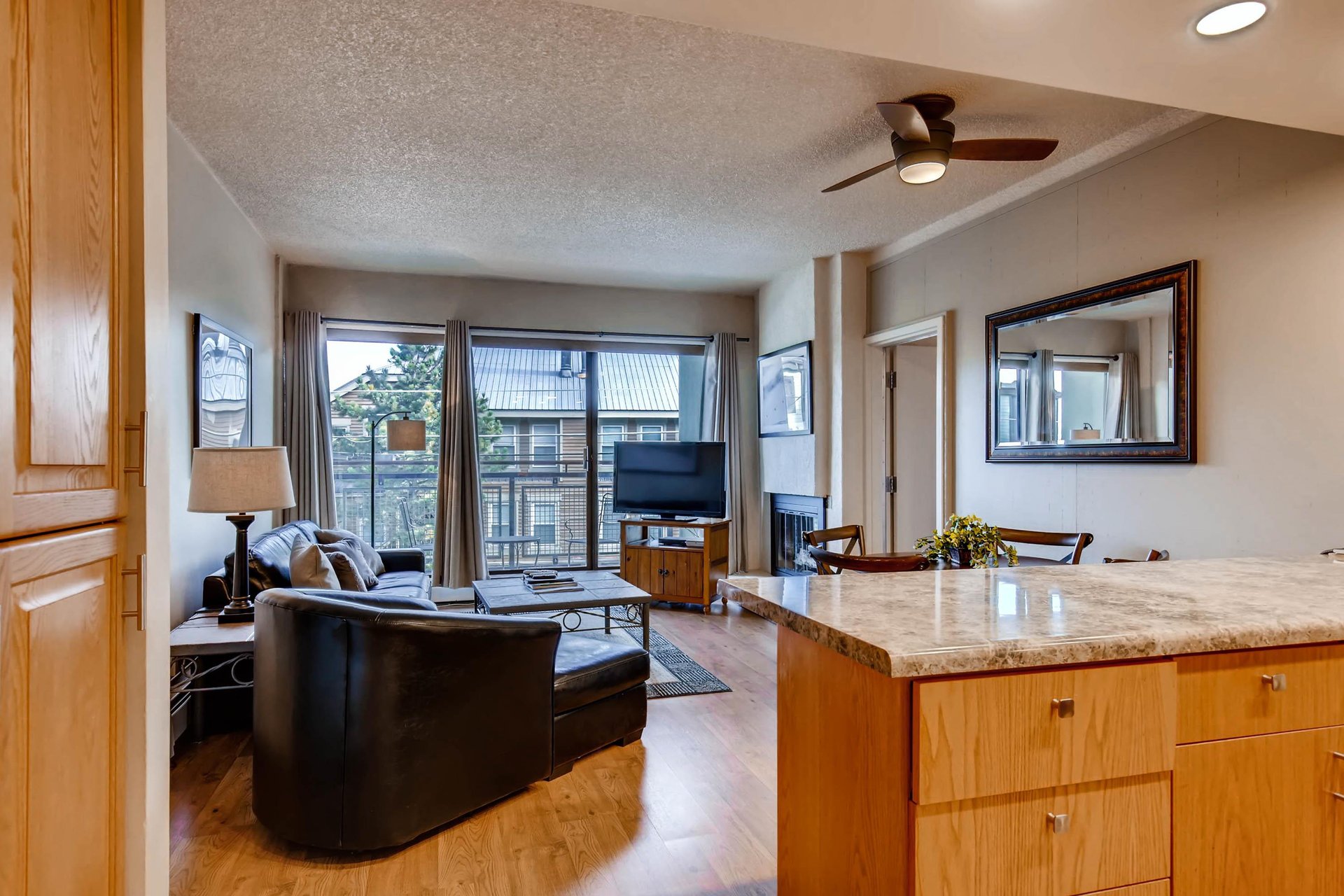 Comfortable open concept kitchen, dining, and living room.