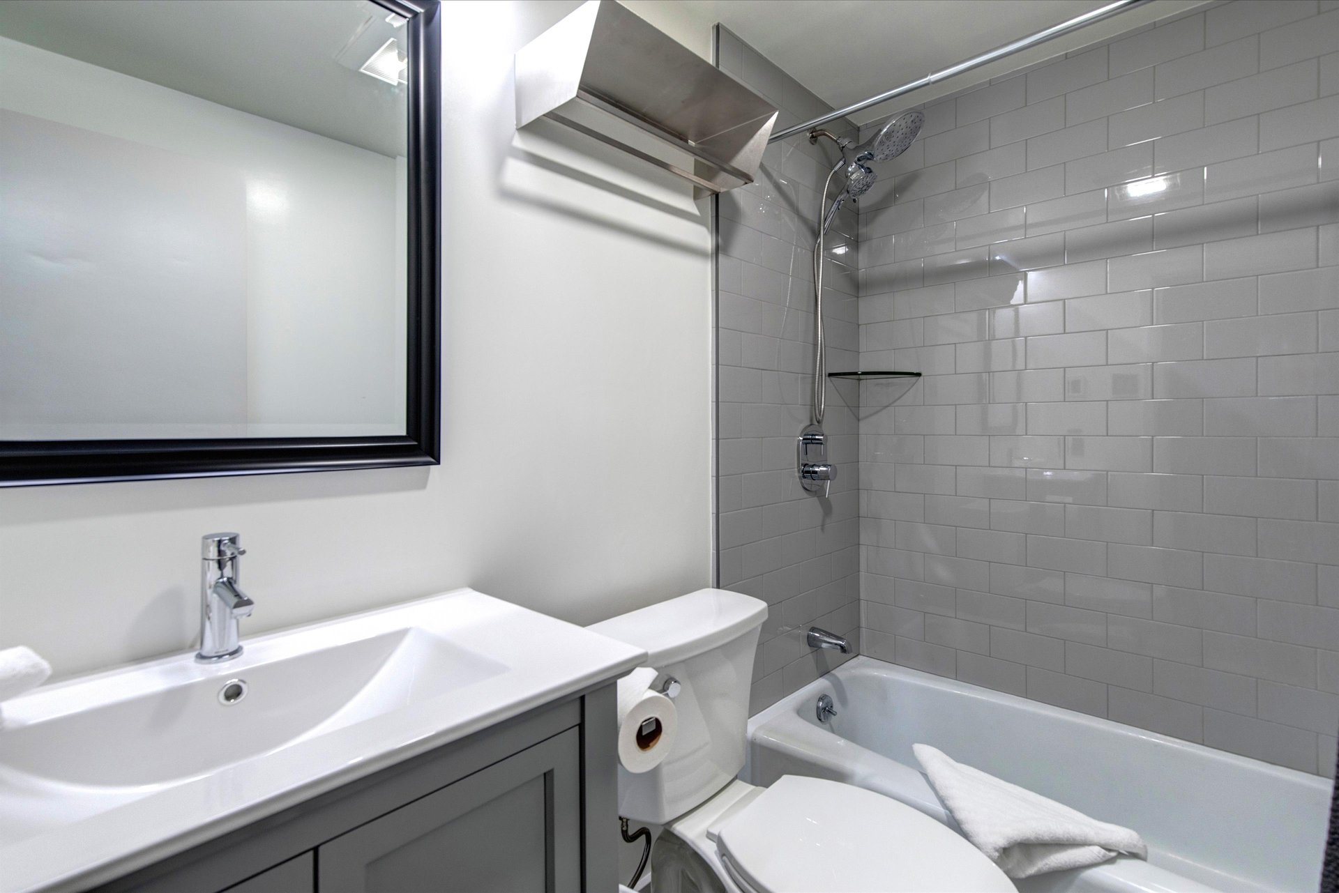 The bathtub and shower combination.