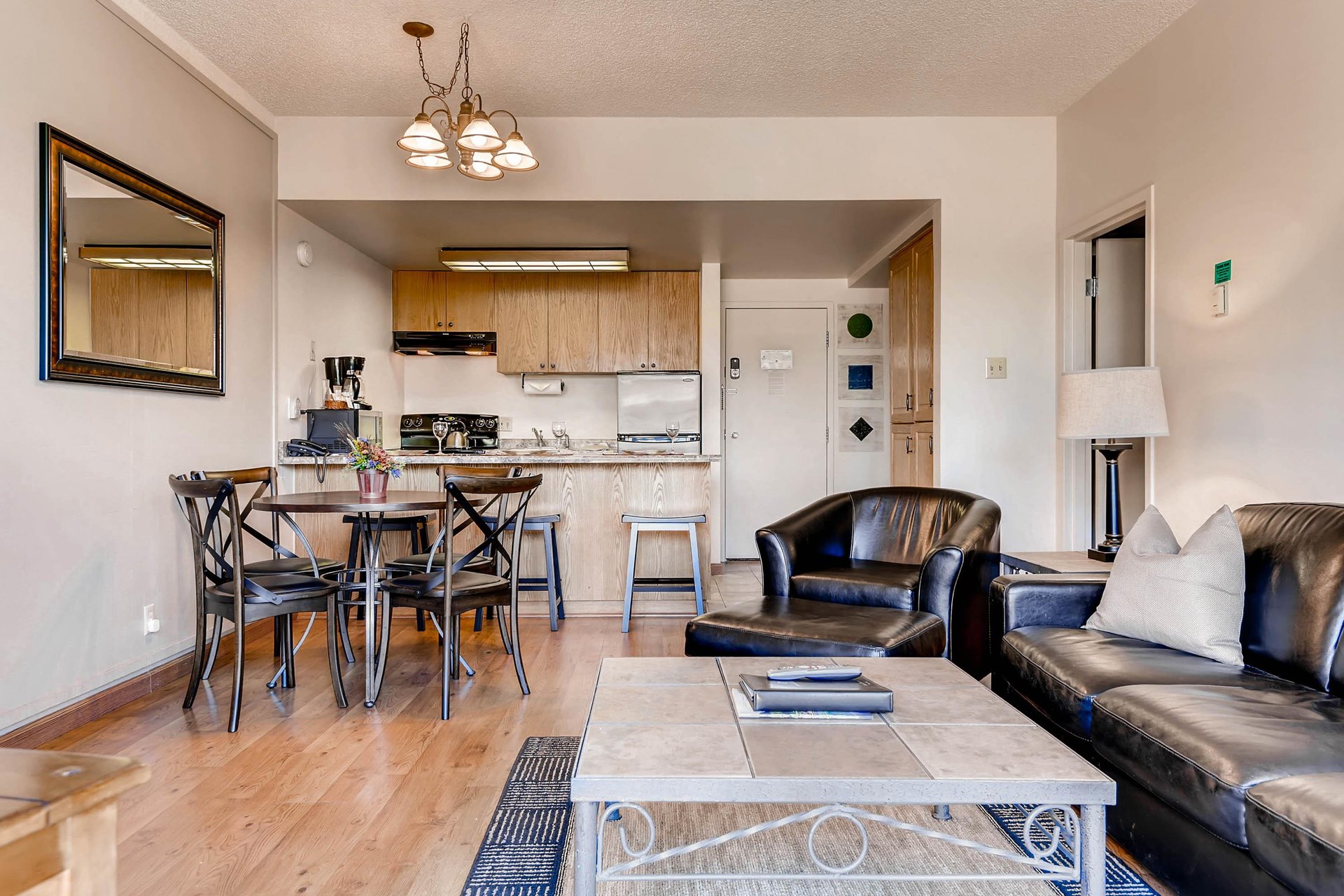 Comfortable open concept kitchen, dining, and living room.