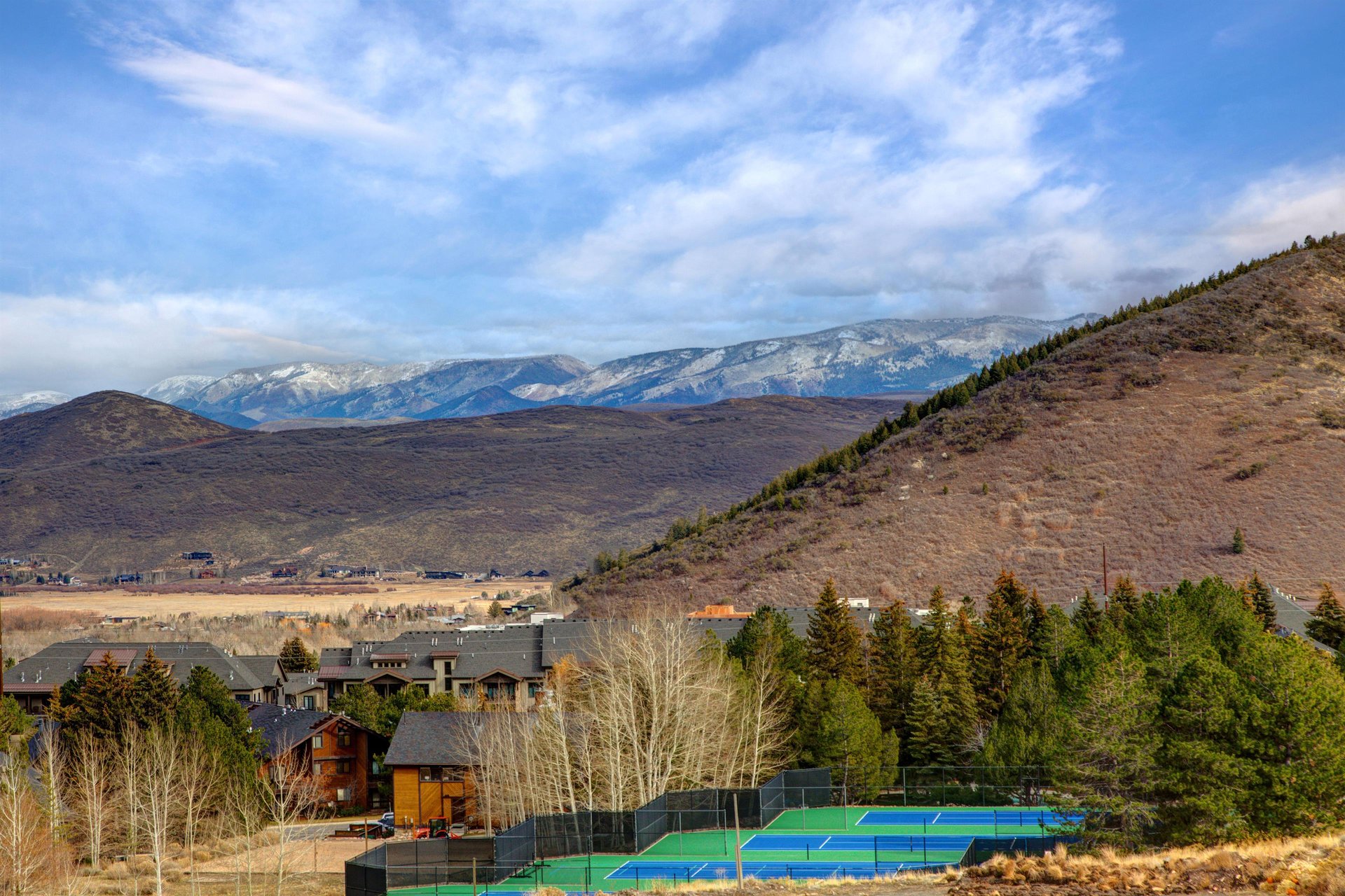 Stunning mountain landscape surrounds this scenic Utah valley location with snowcapped peaks and rolling hills.