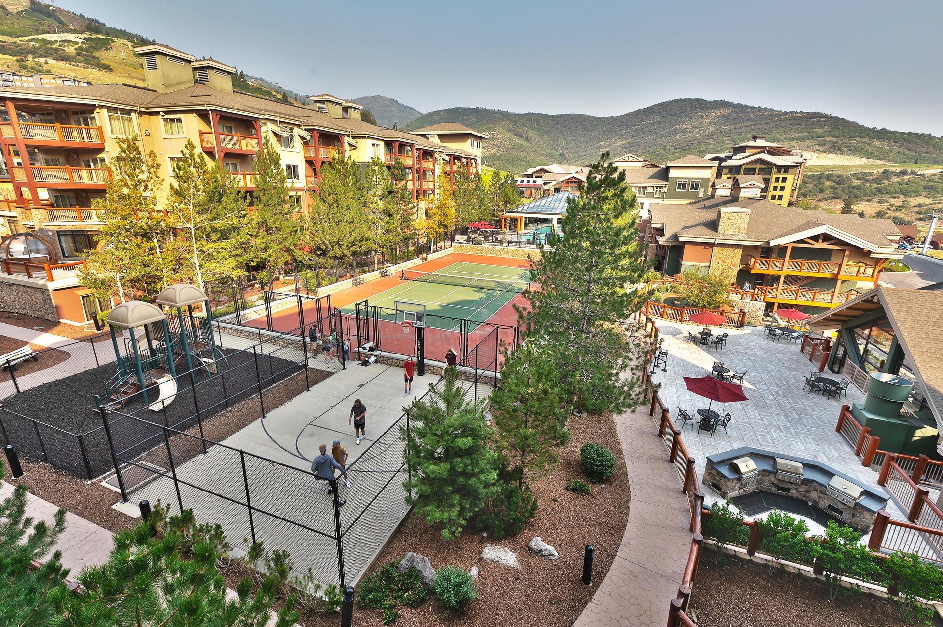 Aerial view of tennis courts, playground, and basketball court