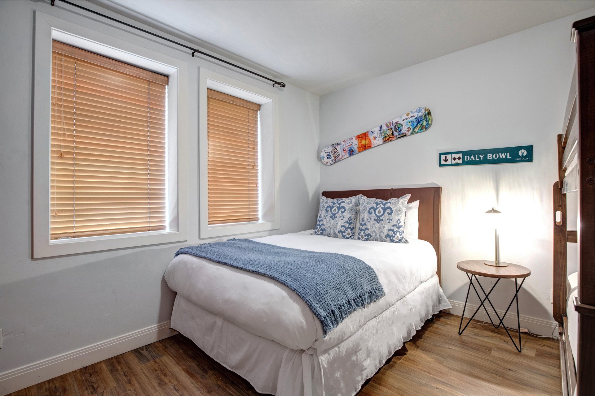 Your cozy bedroom features unique local touches like vintage ski memorabilia.