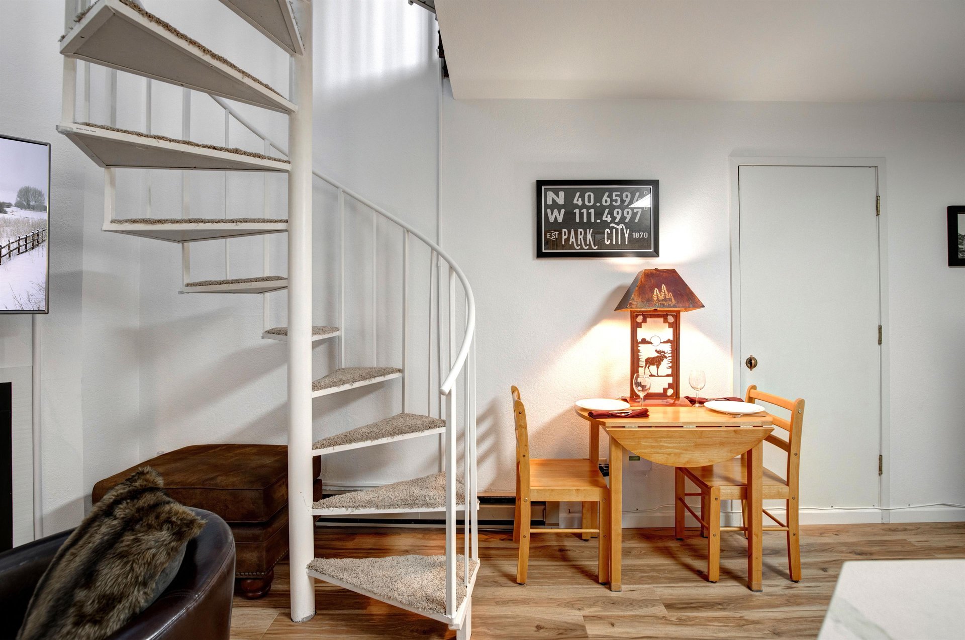 Your cozy retreat features a charming spiral staircase and intimate dining nook, perfect for enjoying morning coffee or planning your Park City adventures.