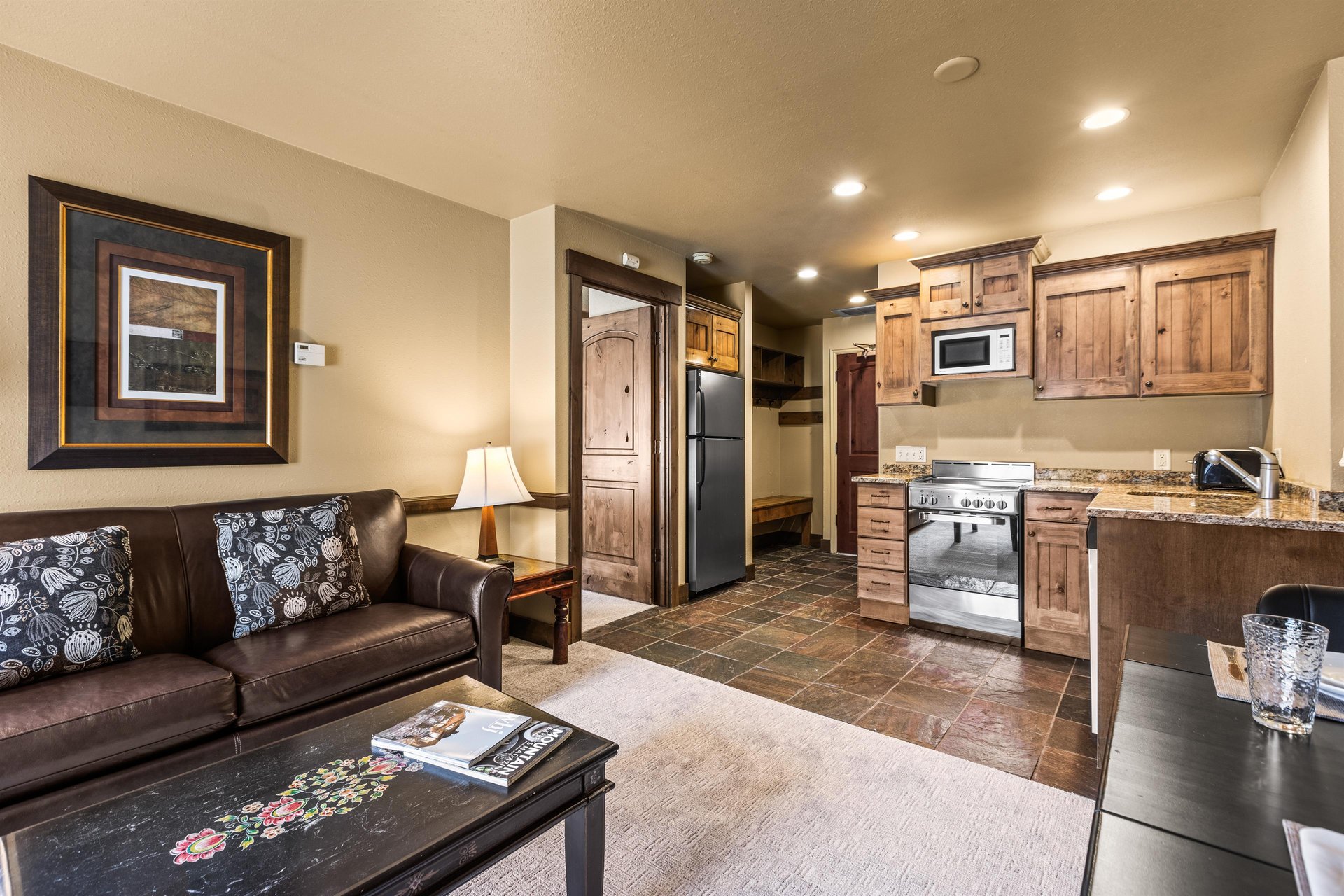 The open concept living area with efficient kitchen.