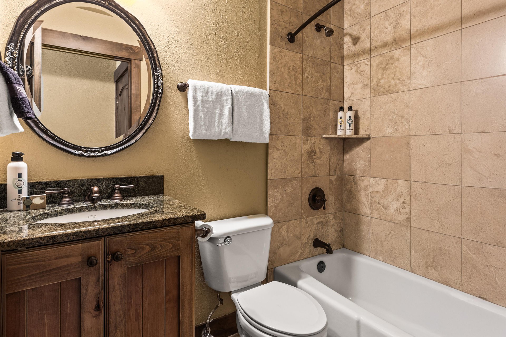 The en suite bathroom with a bathtub and shower combination.