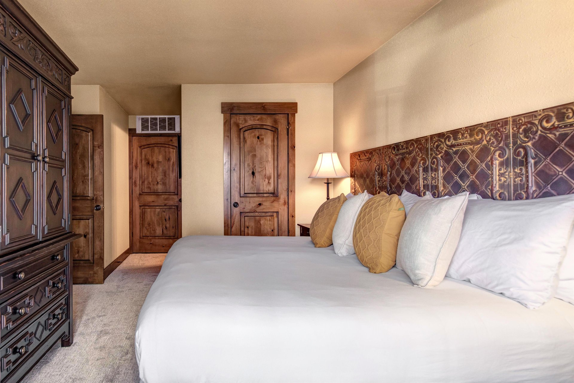 Sink into crisp white linens and plush pillows in your elegantly appointed bedroom with en suite bathroom.