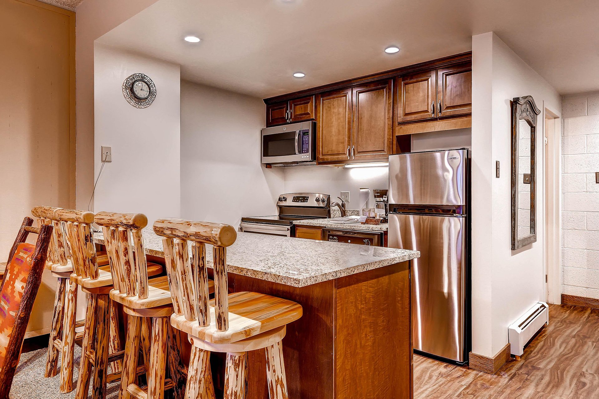 Breakfast bar seating for 4 with a full kitchen.