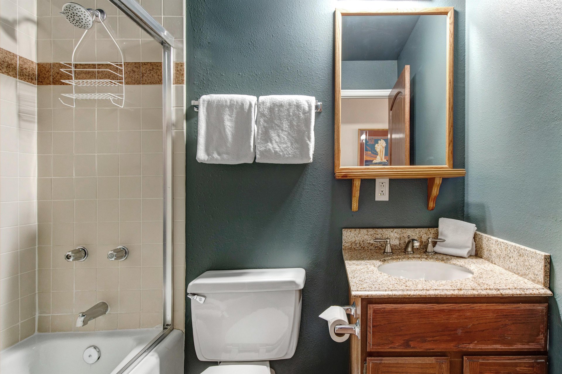 The en suite bathroom with a bathtub and shower combination.
