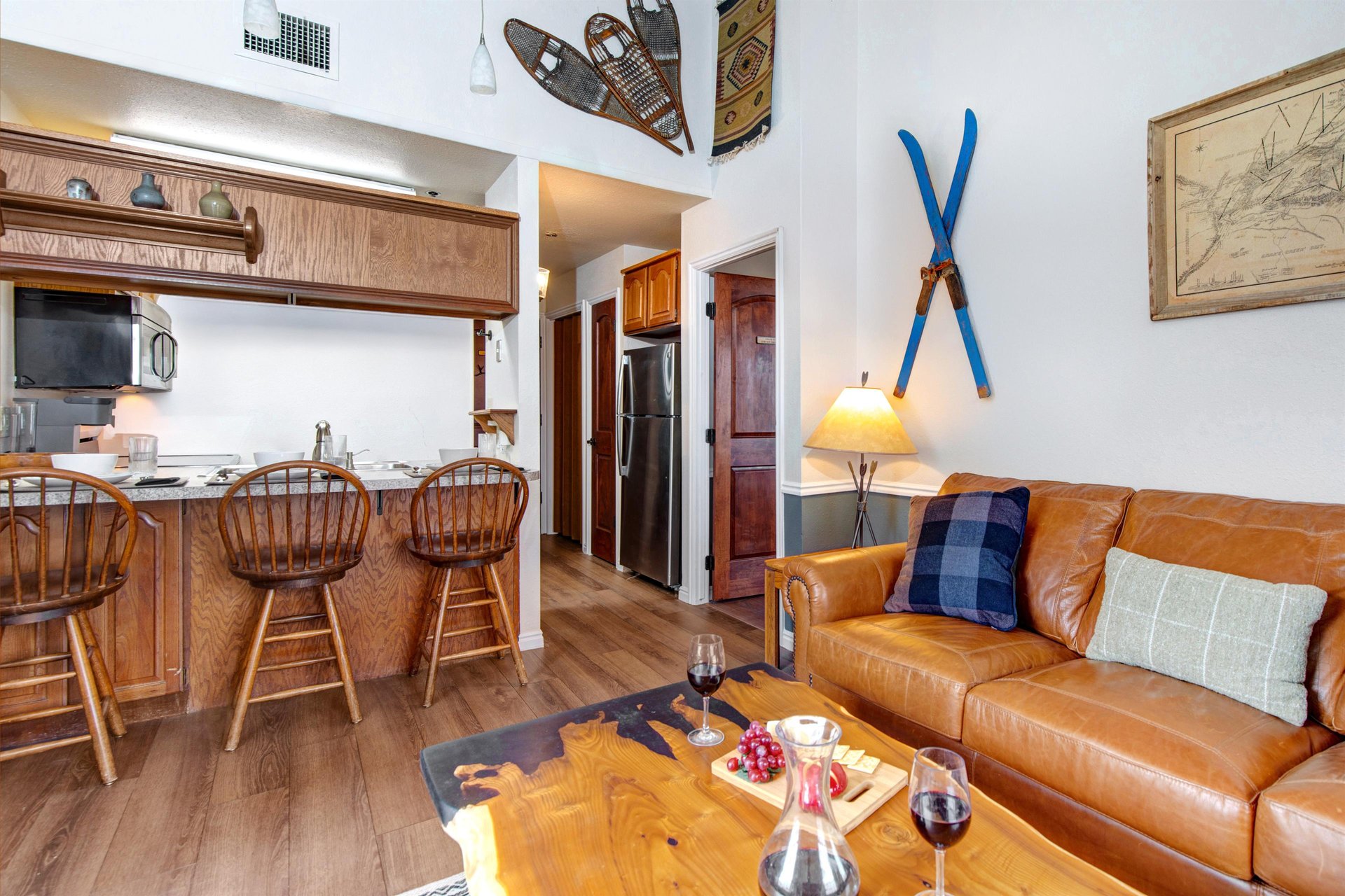 Unwind in your cozy living space with rich leather seating and rustic touches.