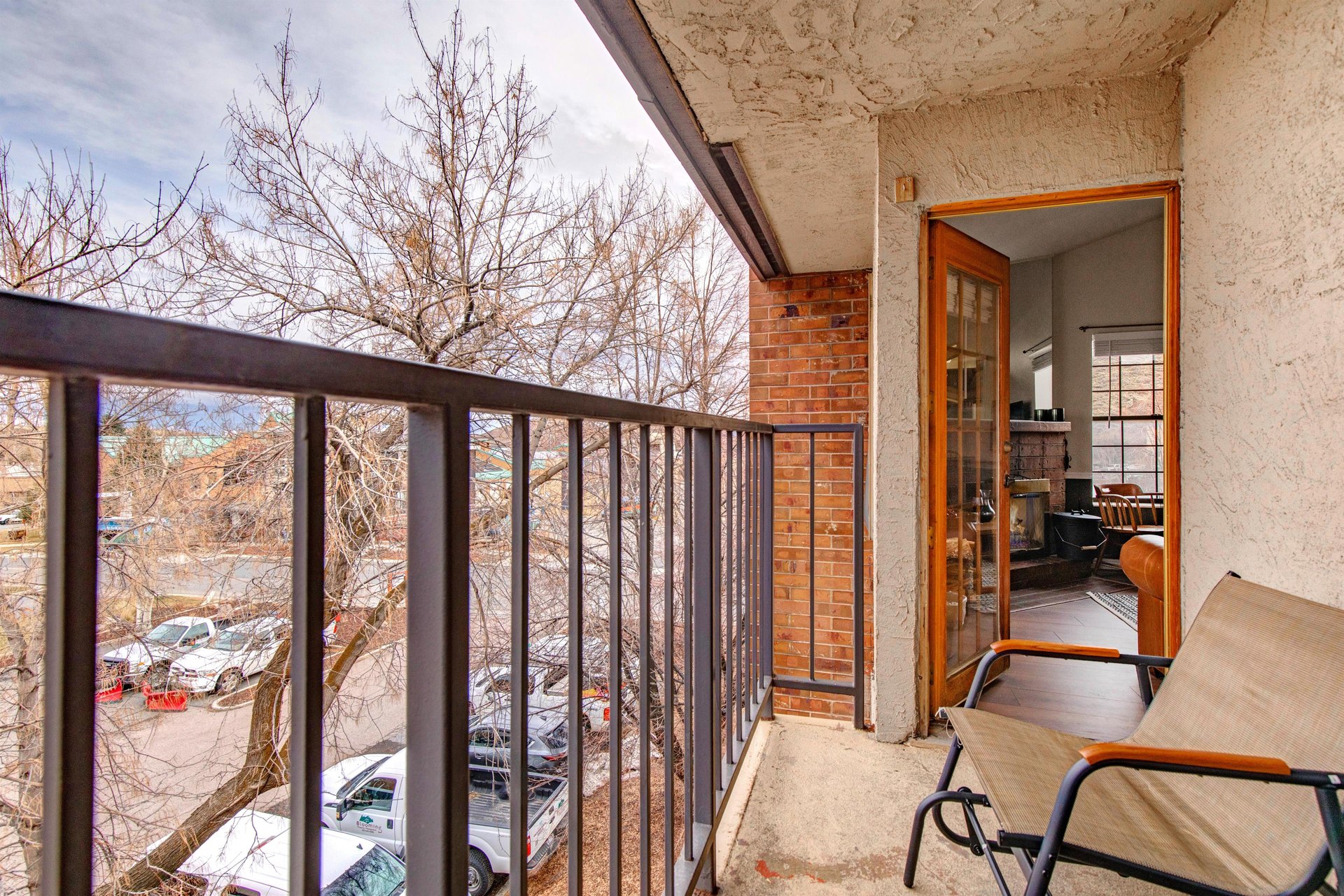 The private balcony with two chairs.