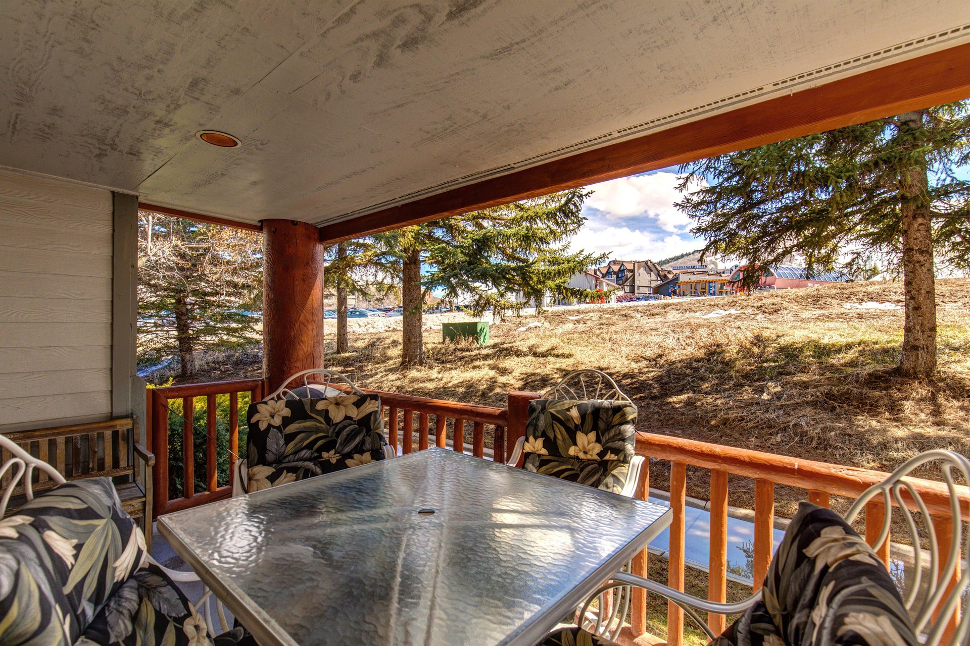 Snow Flower 6 has a private patio with a table and four chairs with comfortable cushions.