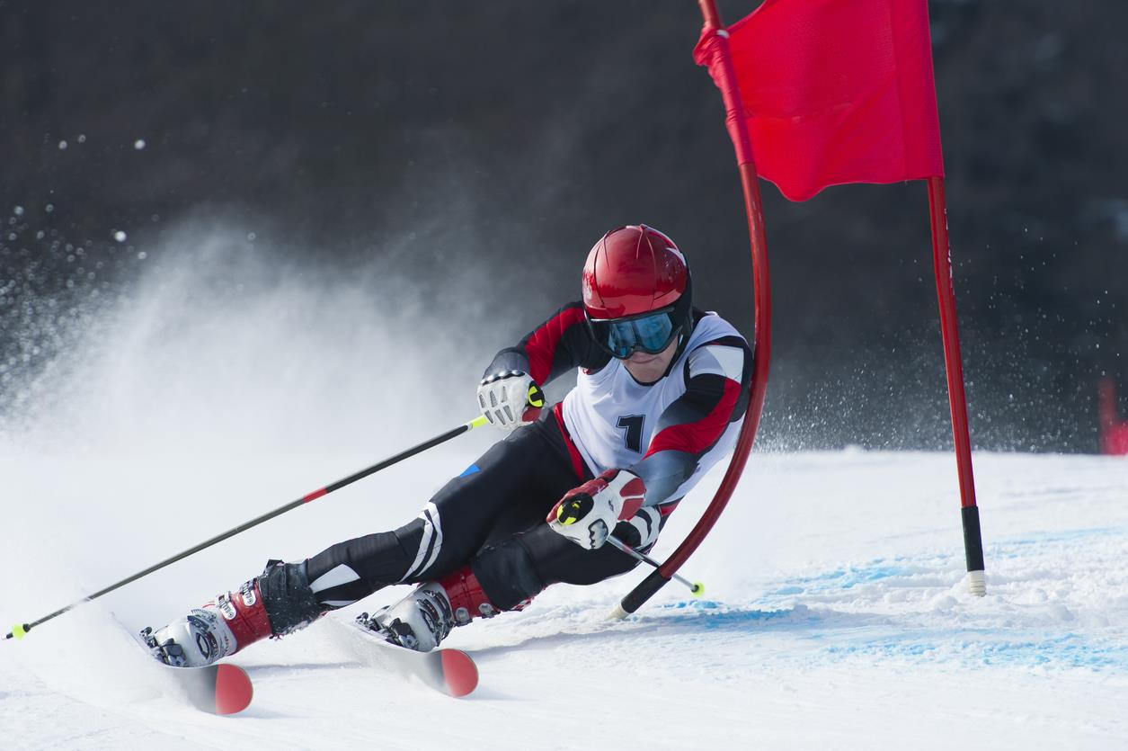 2026 NCAA championships in Park City, Utah A slalom skier running passing a gate.
