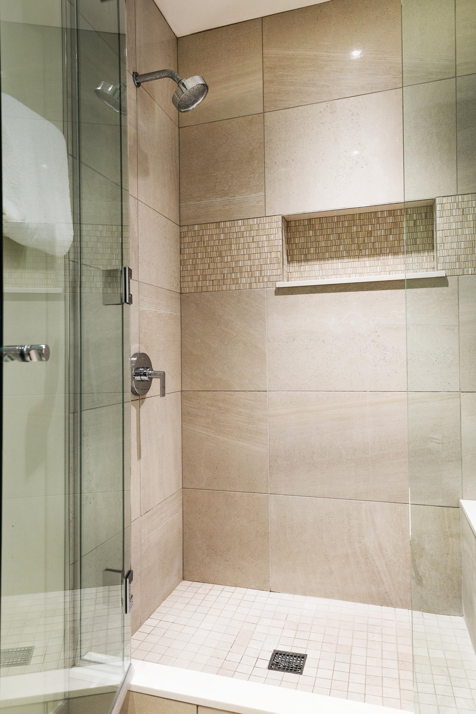 Spacious shower in the main bath with beautiful tile work