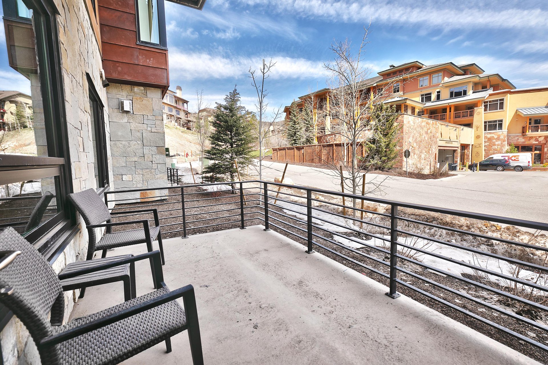 Relaxing chairs and side table on the private patio