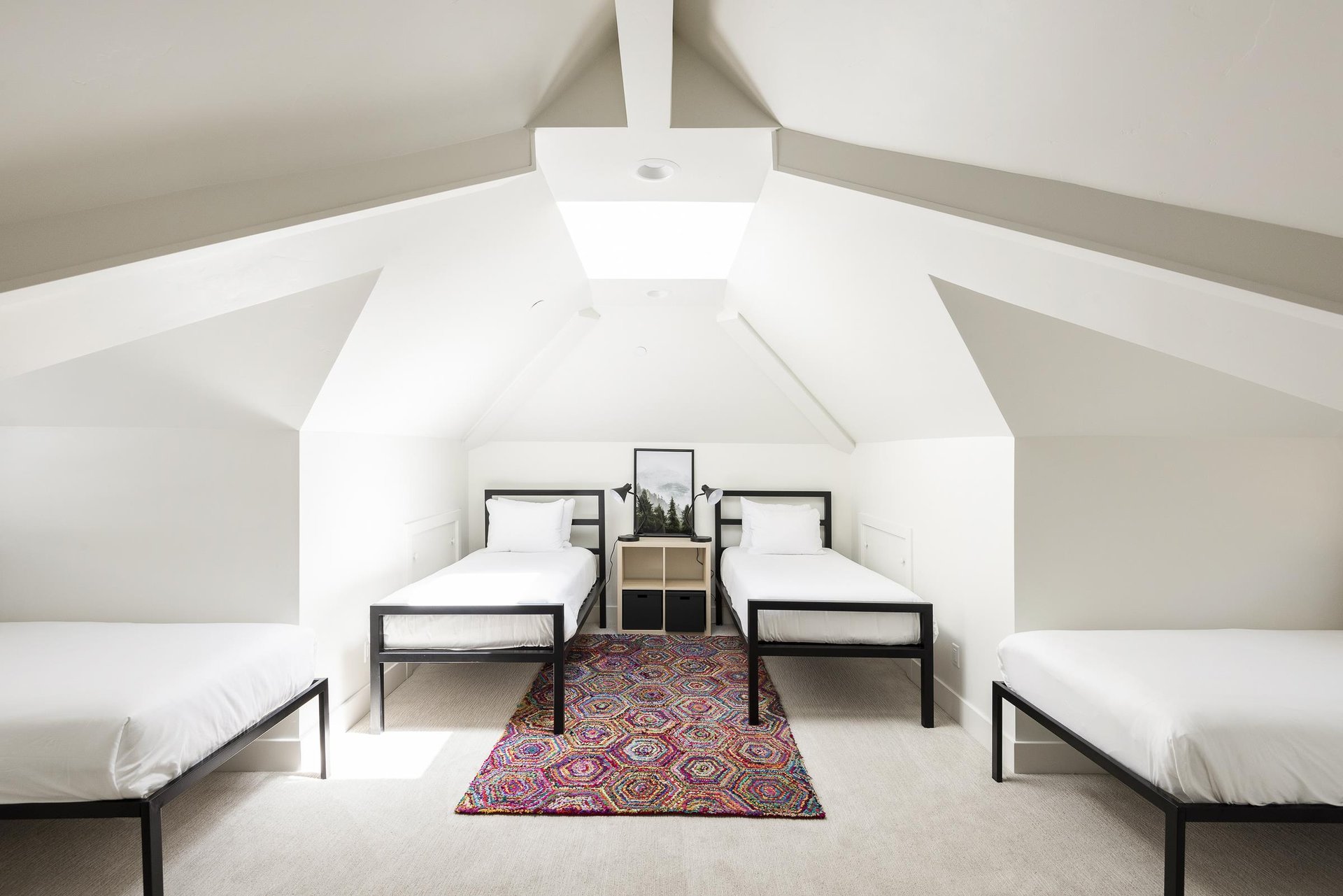 Upstairs bedroom with 4 twin beds and cathedral vaulted ceiling